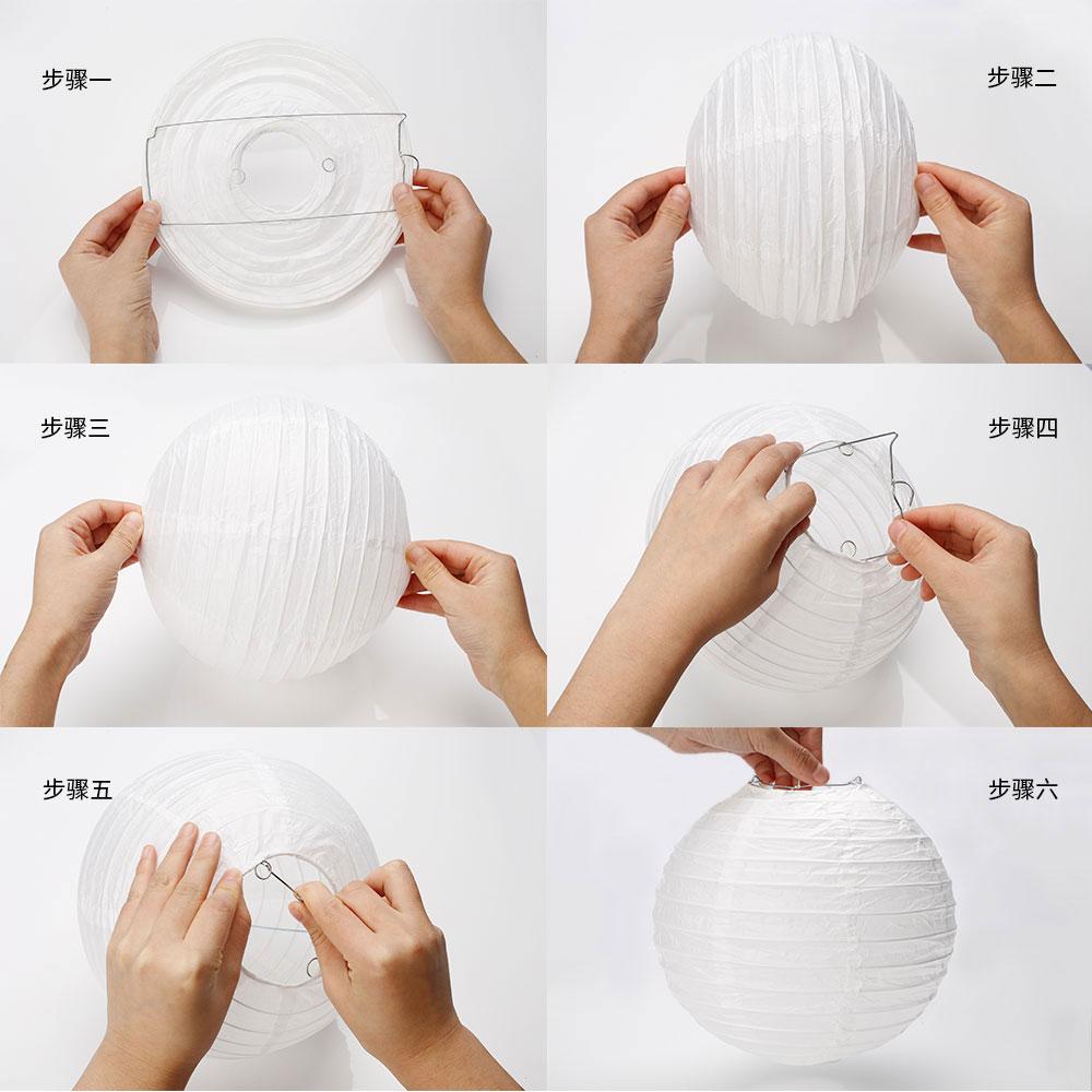 A set of colorful LED paper lantern lights hanging outdoors, illuminating a wedding venue with a warm glow.