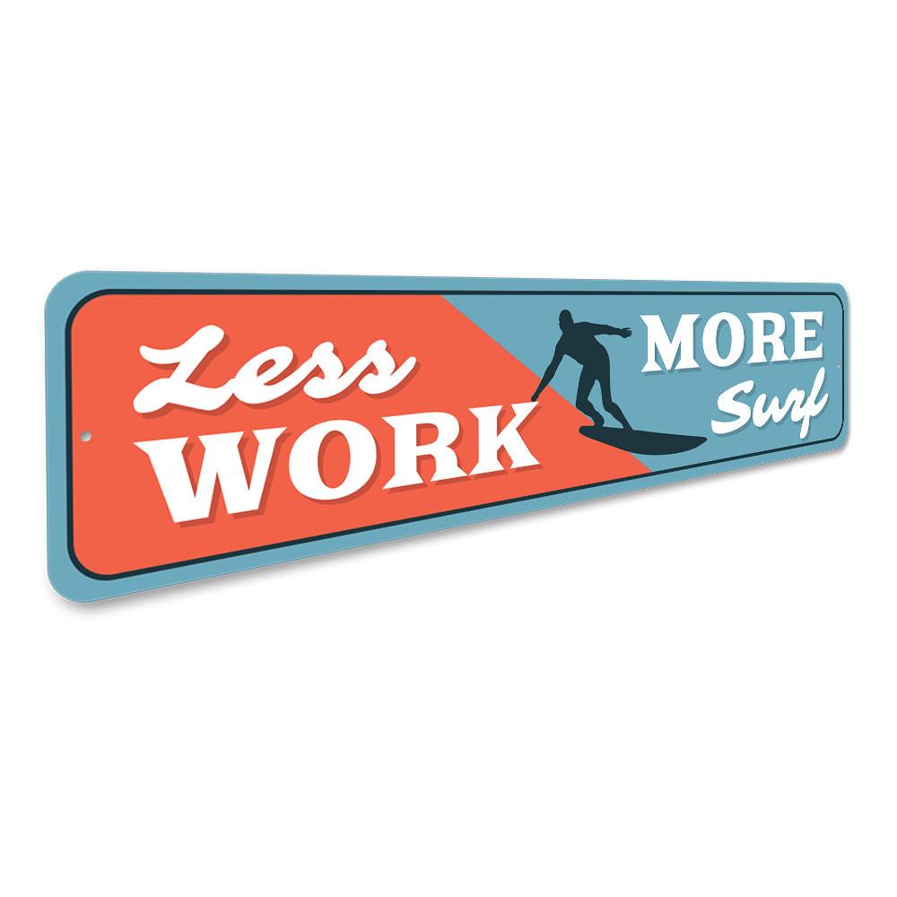 A decorative Less Work More Surf Sign made of high-quality aluminum, featuring vibrant colors and a beach-themed design, perfect for surf enthusiasts.