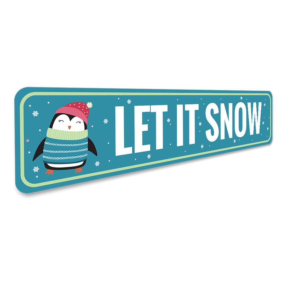 Let It Snow Penguin Holiday Sign featuring a cheerful penguin design, perfect for Christmas decorations.