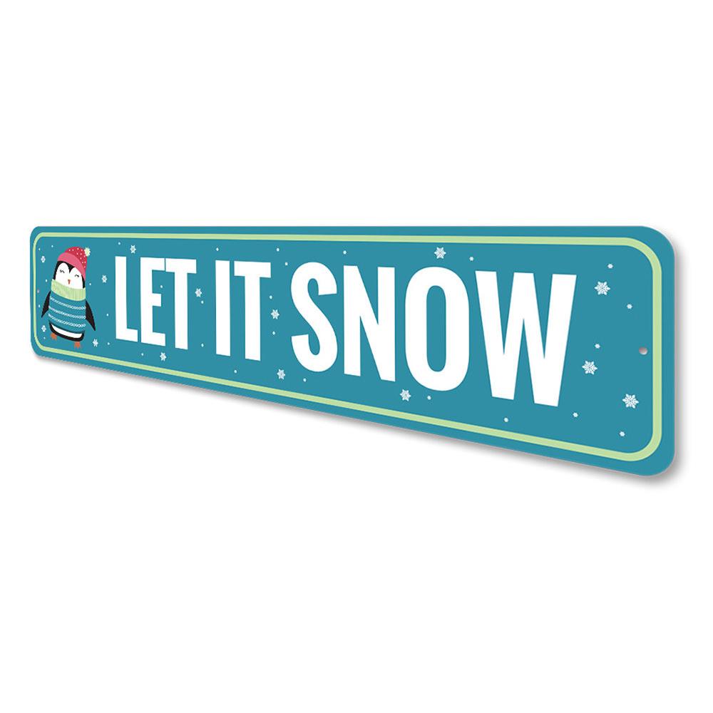 Let It Snow Penguin Holiday Sign featuring a cheerful penguin design, perfect for Christmas decorations.