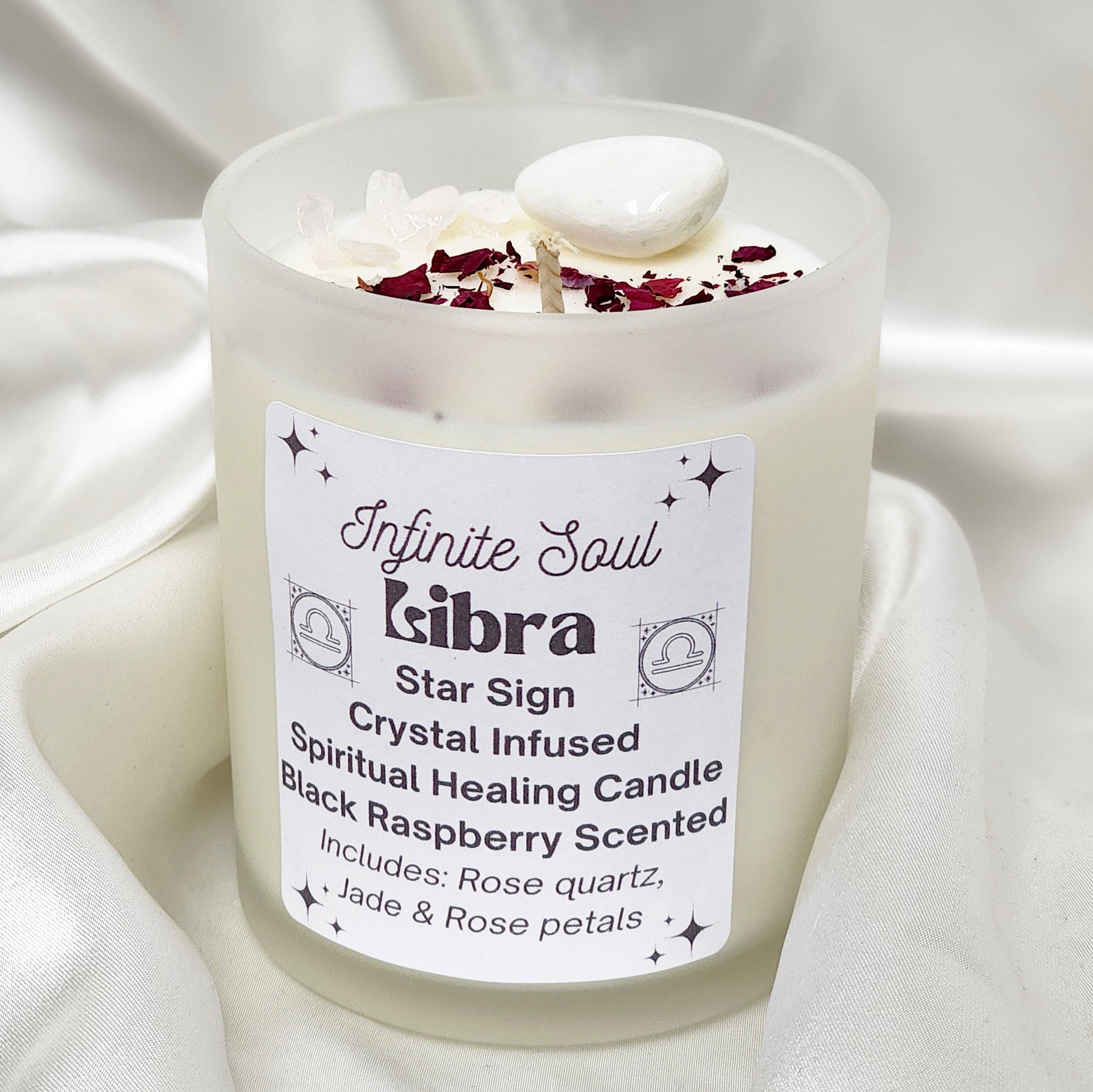 Libra Star Sign Crystal Infused Candle with black raspberry scent, featuring rose quartz and jade crystals, in a clear or frosted jar adorned with dried rose petals.