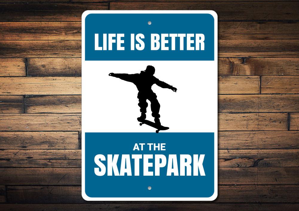 A decorative metal sign reading 'Life is Better at the Skatepark', showcasing vibrant colors and a stylish design, perfect for skateboarding enthusiasts.