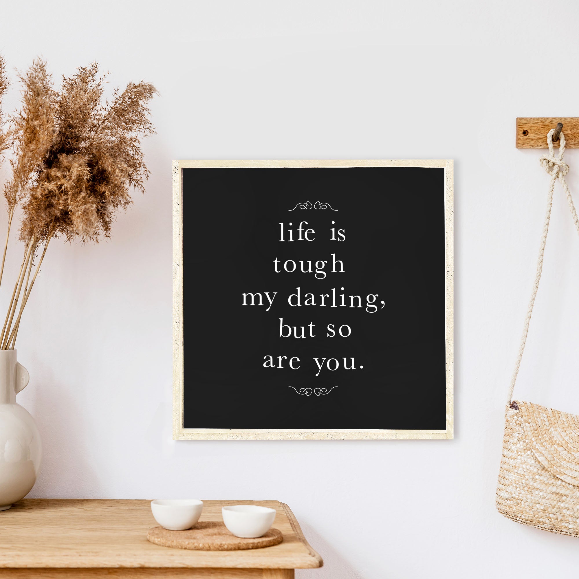 A charming 13x13 inch wood sign with the phrase 'Life Is Tough My Darling' in black text on a white background, framed in stained pine wood.