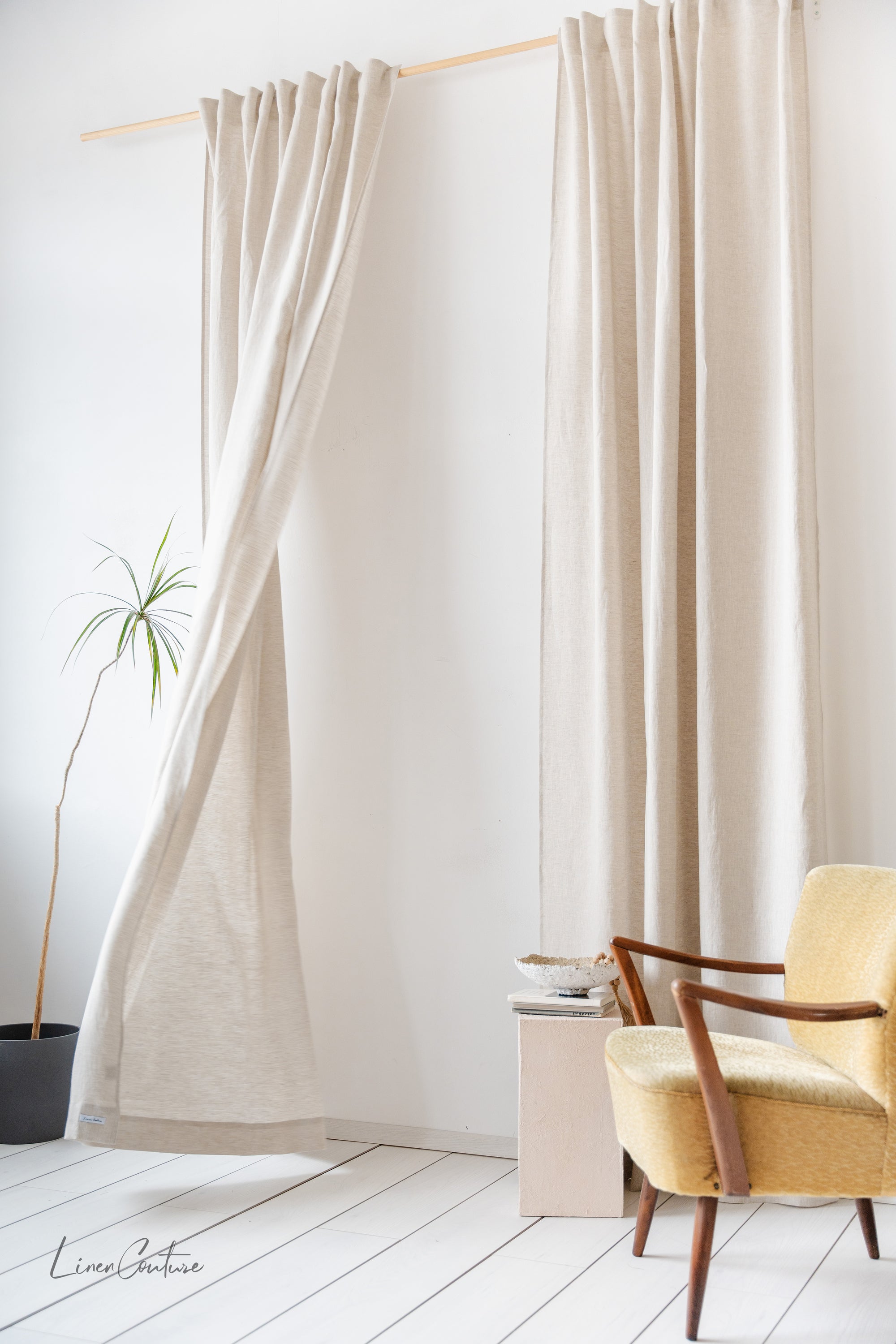 Elegant semi-sheer linen curtain with multifunctional heading tape, showcasing a contemporary dark color, perfect for enhancing home decor.