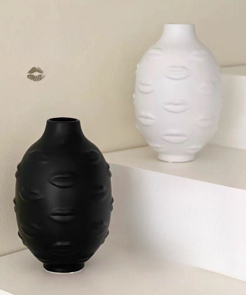 A modern abstract ceramic flower vase with moody mouth designs, showcasing a unique artistic flair for home decor.