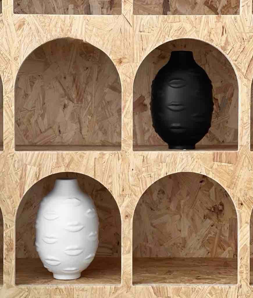 A modern abstract ceramic flower vase with moody mouth designs, showcasing a unique artistic flair for home decor.