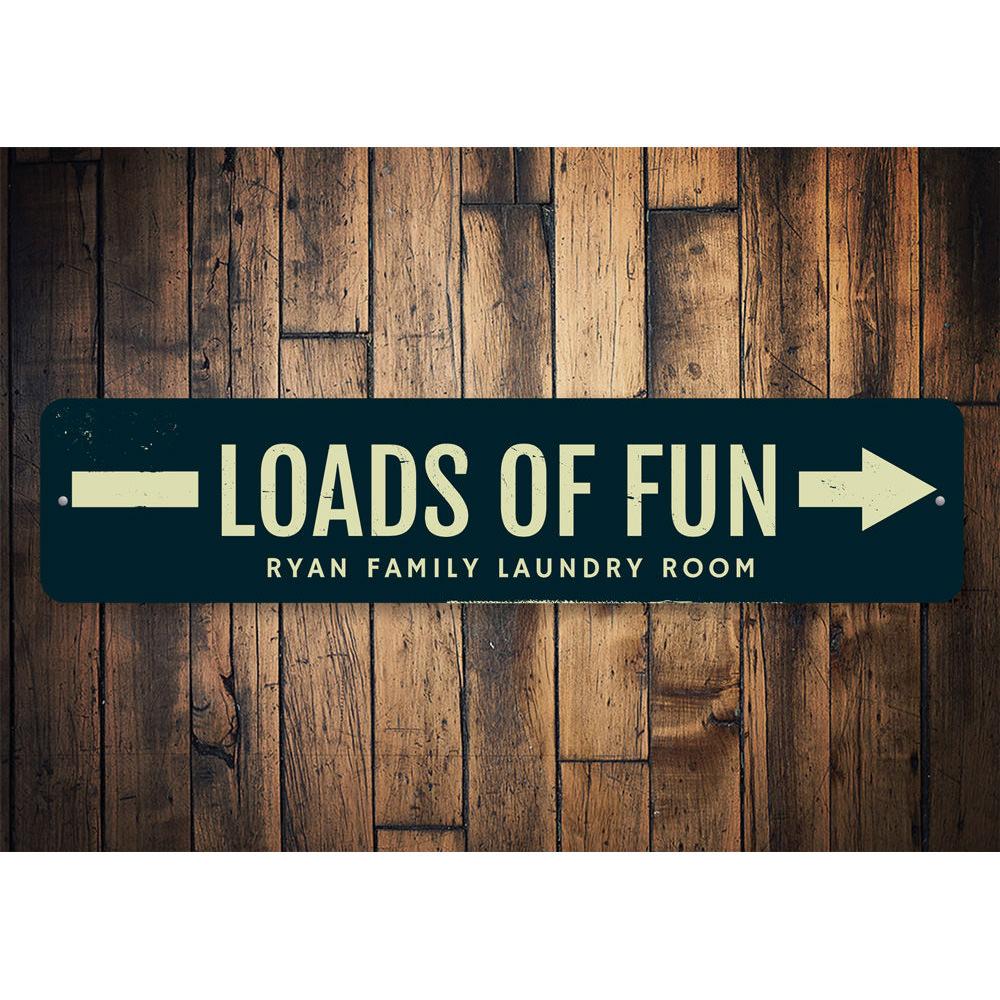 A decorative Loads of Fun Laundry Sign made from high-quality aluminum, featuring a playful design perfect for laundry room decor.