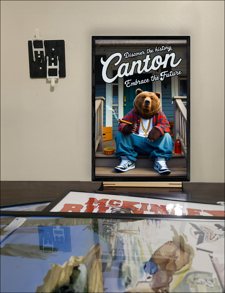 Local Visit Canton Poster featuring a bear on the porch, framed in a solid MDF wood frame, showcasing vibrant colors and a matte finish.