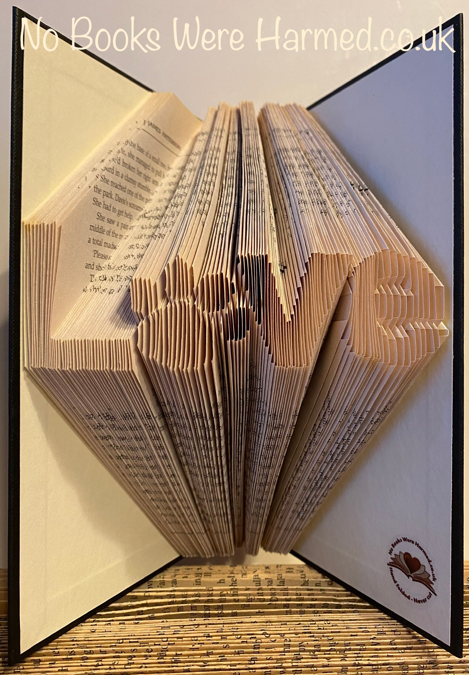 Unique 'Love' art piece featuring a dog or cat paw print, handcrafted from vintage book pages.