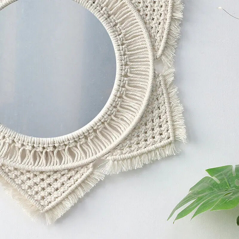 A beautifully crafted macrame hanging decorative wall mirror with intricate cotton rope design, perfect for boho chic decor.