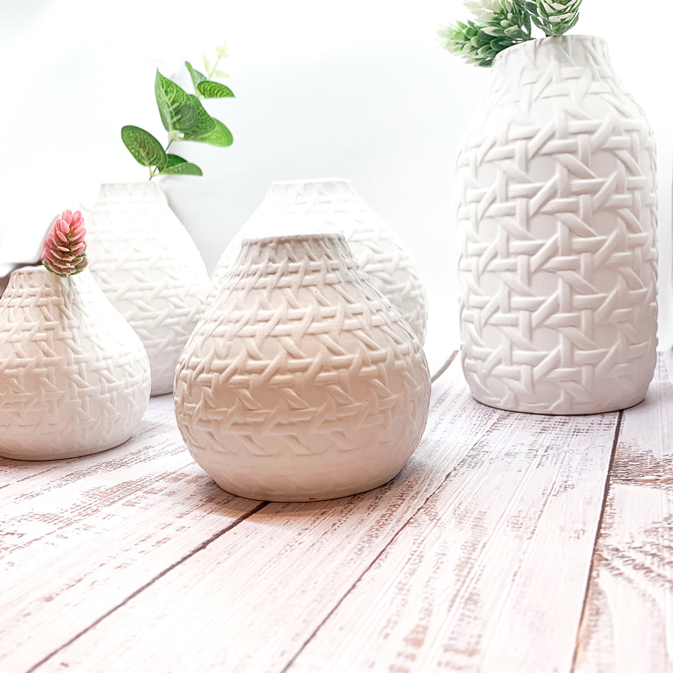 Madison Web Vases featuring embossed cane webbing design in assorted sizes, perfect for floral arrangements or as decorative pieces.