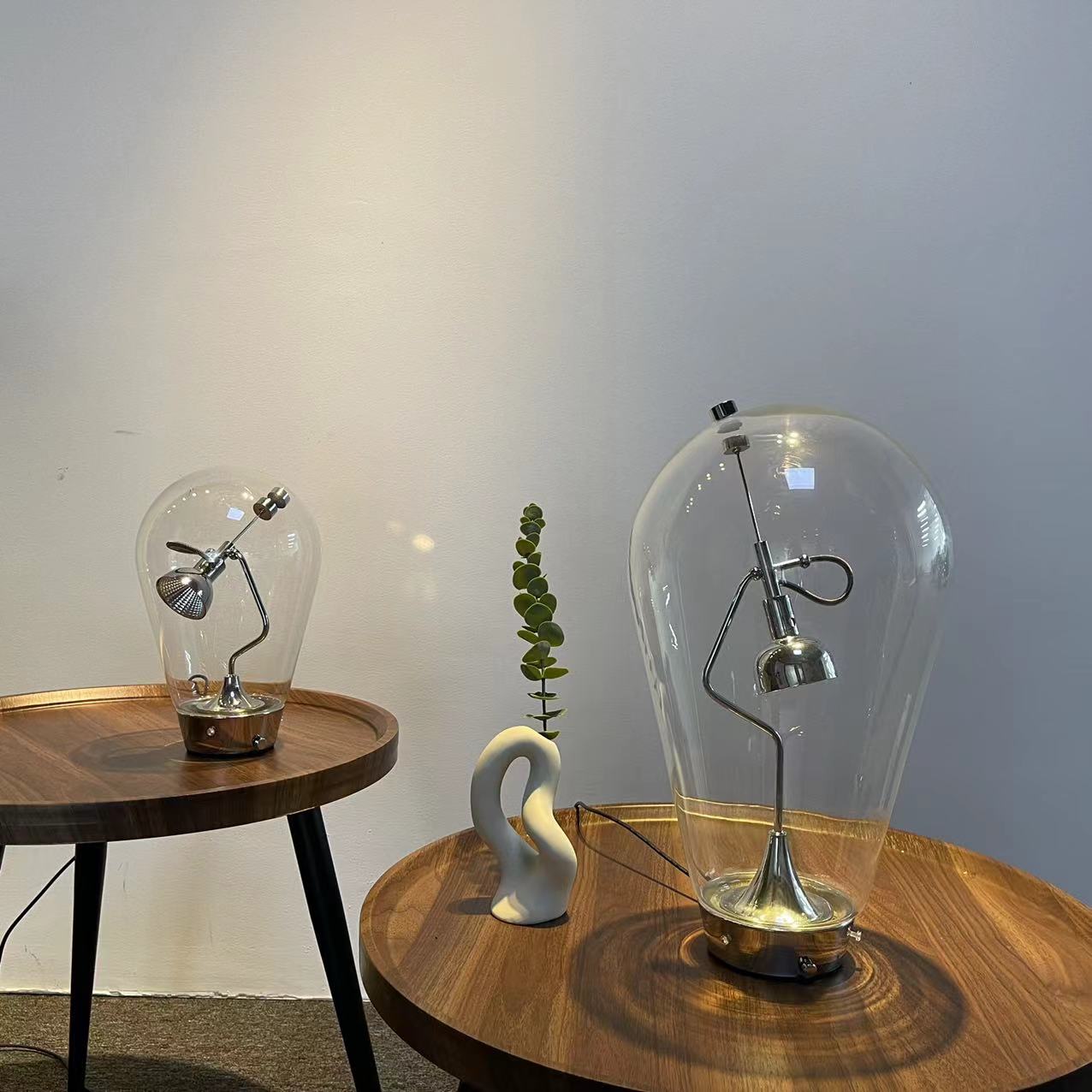 Magnetic Dimmable Table Lamp featuring a clear glass shade and nickel-plated base, showcasing its modern geometric design.