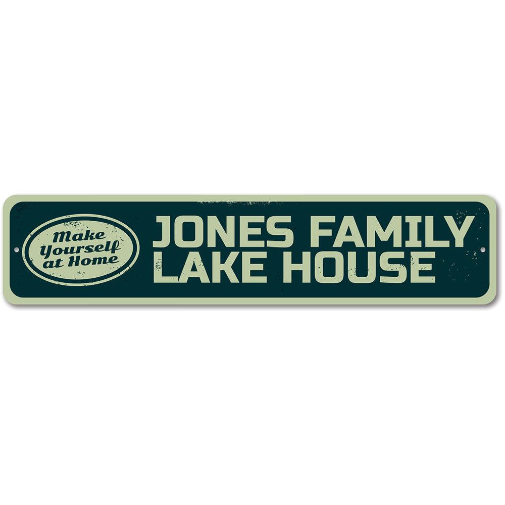 A beautifully crafted Make Yourself at Home Lake Sign made from durable aluminum, featuring customizable text and a rustic design, perfect for lakehouse decor.