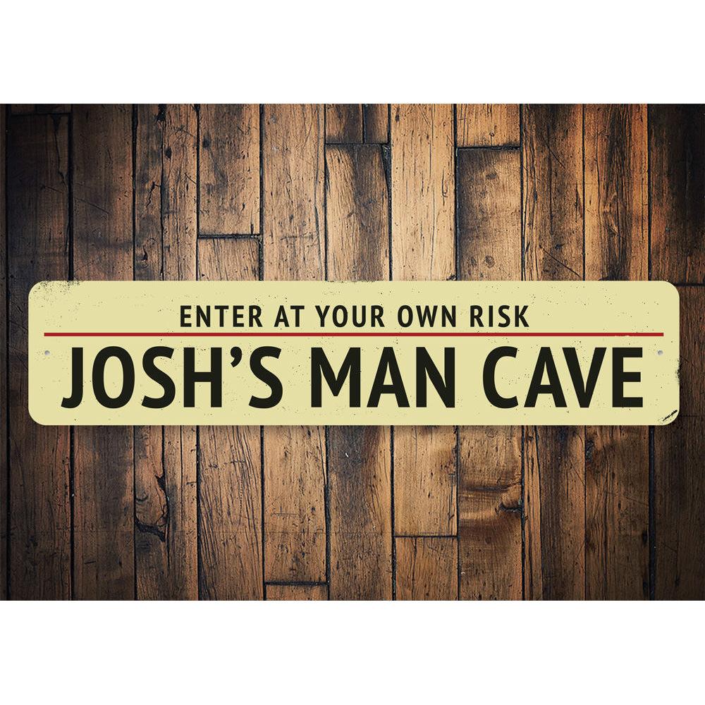 A decorative Man Cave Entrance Warning Sign made of high-quality aluminum, featuring customizable text and pre-drilled holes for easy mounting.