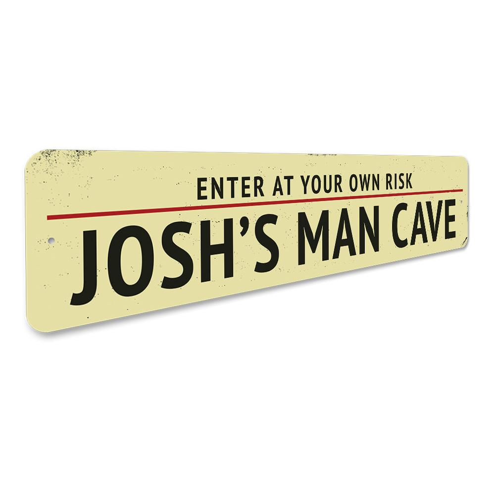 A decorative Man Cave Entrance Warning Sign made of high-quality aluminum, featuring customizable text and pre-drilled holes for easy mounting.