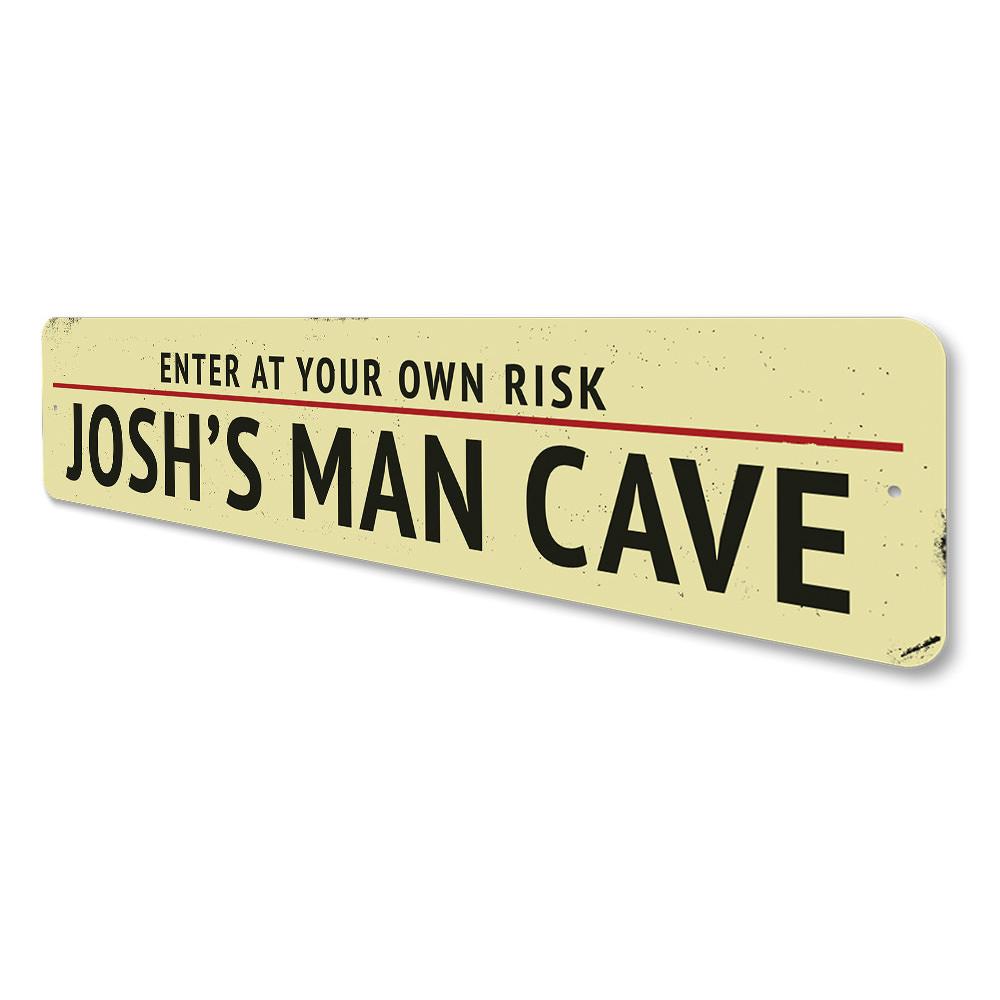 A decorative Man Cave Entrance Warning Sign made of high-quality aluminum, featuring customizable text and pre-drilled holes for easy mounting.