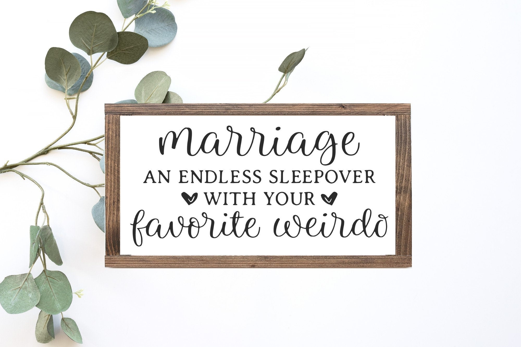 Wooden sign says marriage is fun.