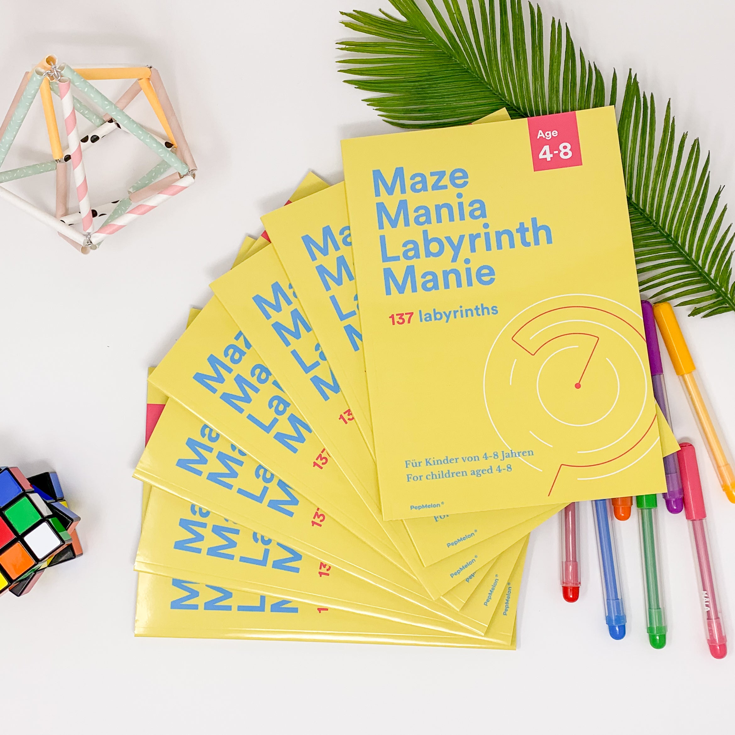 A colorful maze book titled 'Maze Mania' featuring various maze designs suitable for children aged 4-6.