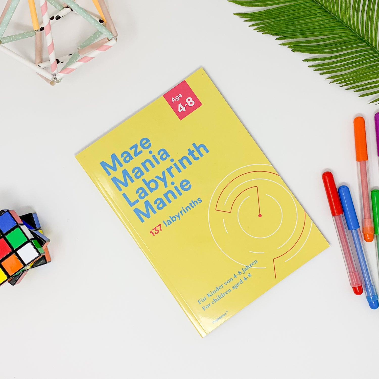 A colorful maze book titled 'Maze Mania' featuring various maze designs suitable for children aged 4-6.