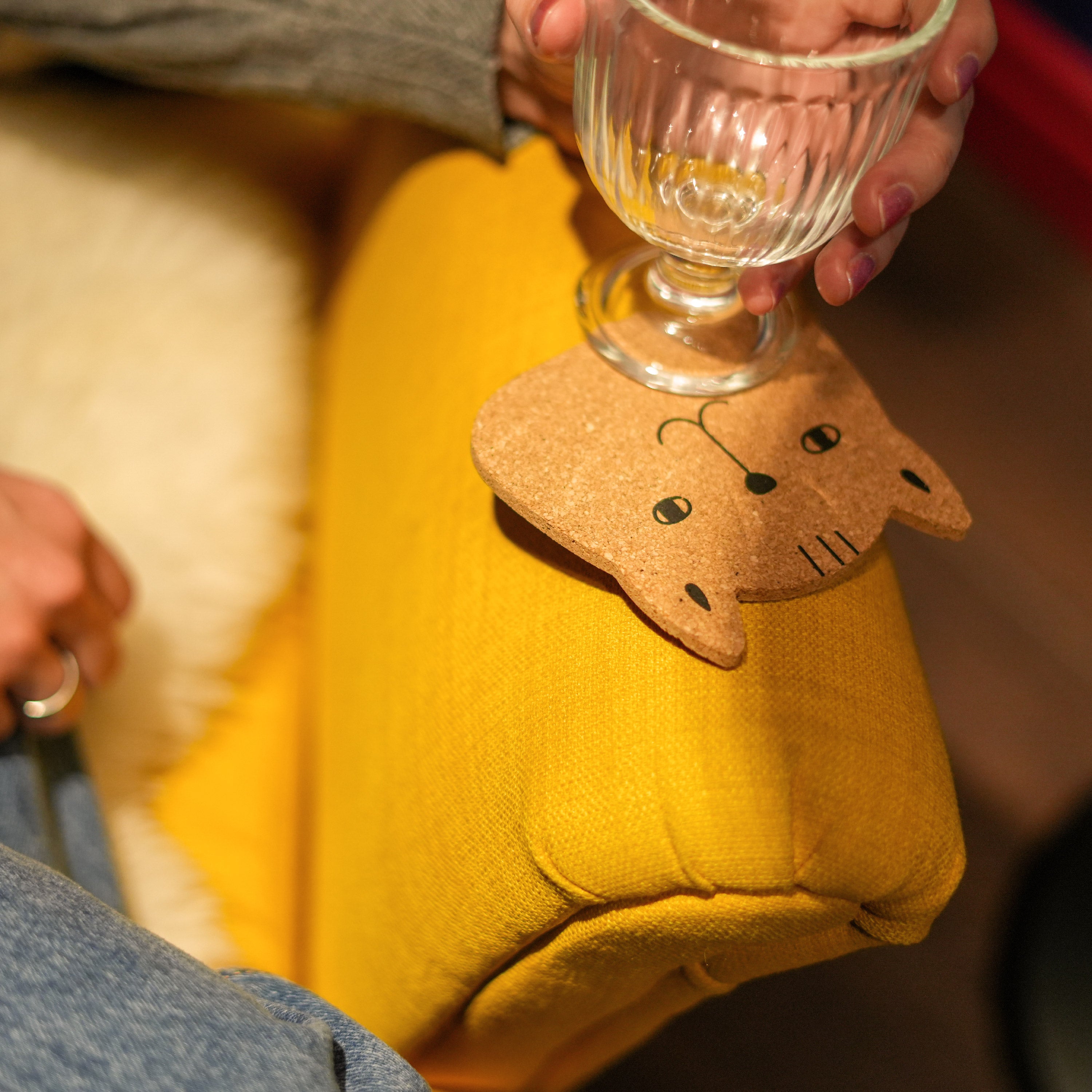 Set of 6 round cork coasters featuring different cute cat faces, perfect for protecting furniture and showcasing love for cats.