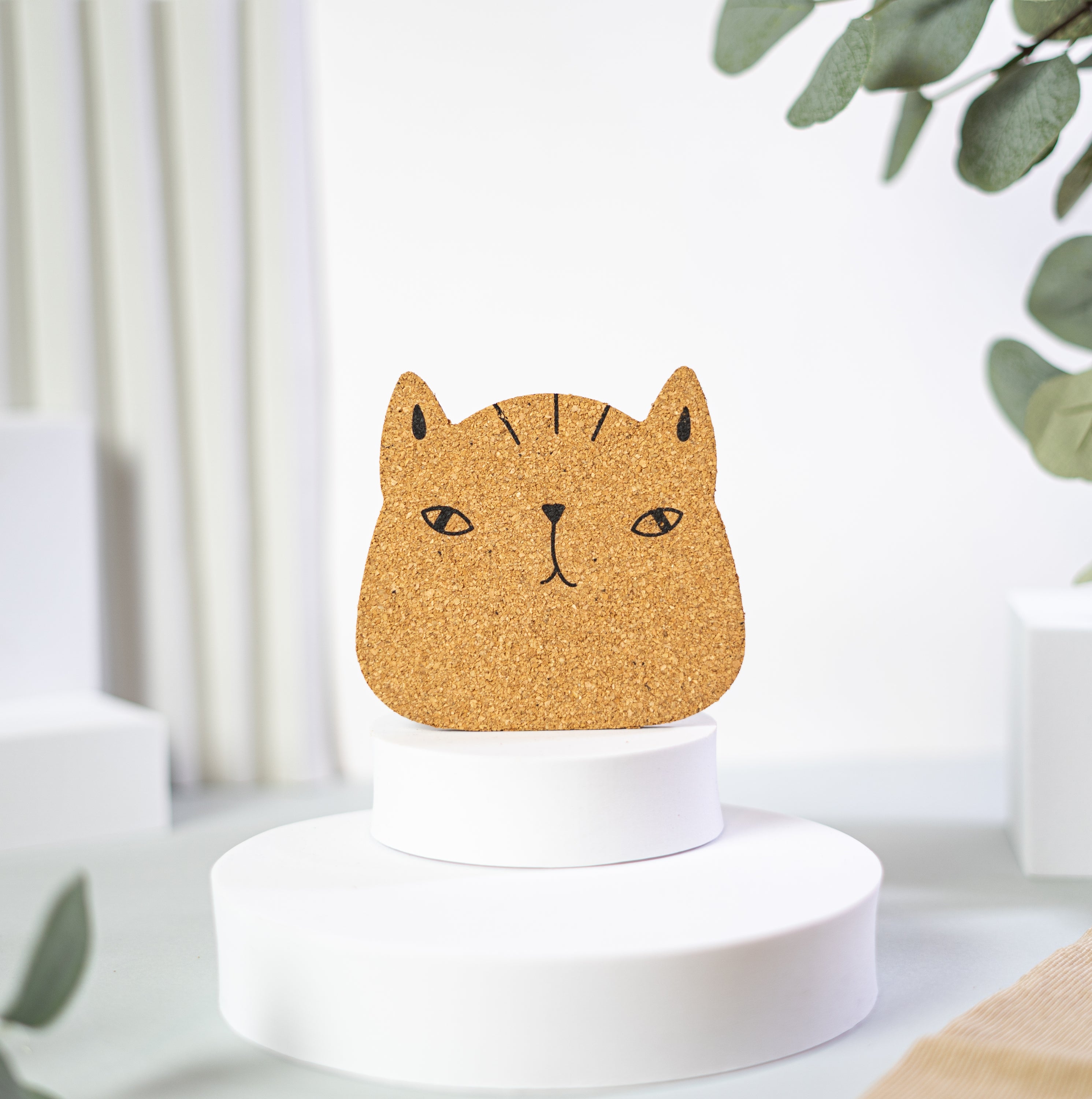 Set of 6 round cork coasters featuring different cute cat faces, perfect for protecting furniture and showcasing love for cats.