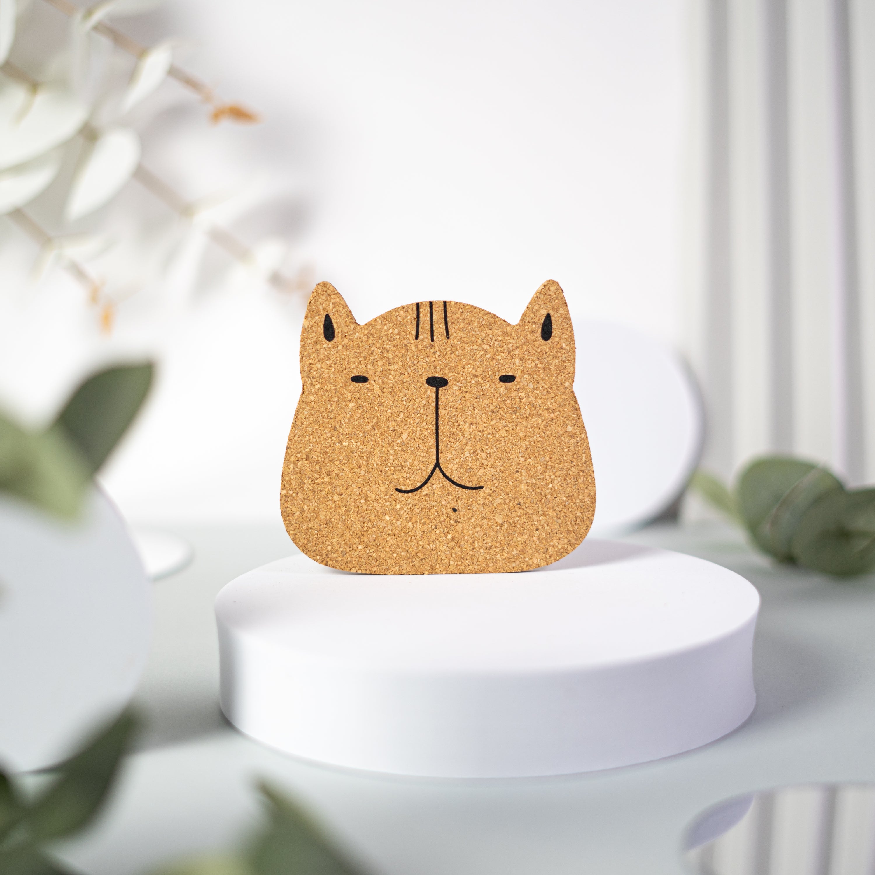 Set of 6 round cork coasters featuring different cute cat faces, perfect for protecting furniture and showcasing love for cats.