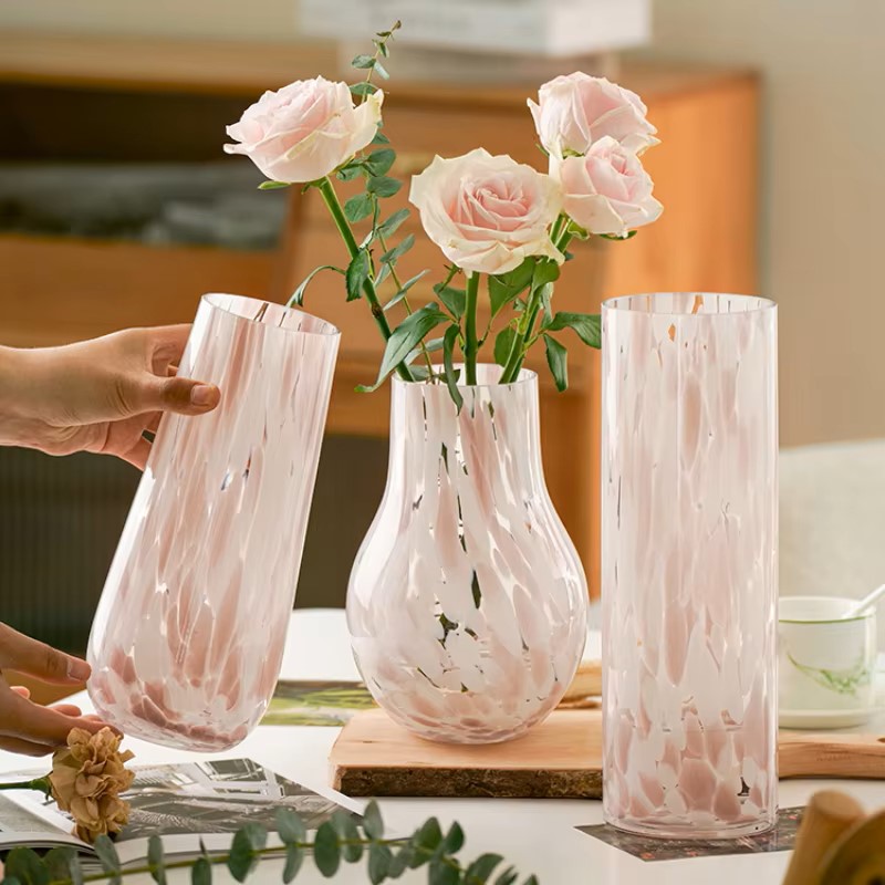 A handcrafted Medieval Glass Vase in pink and white leopard design, showcasing its unique pattern and elegant shape.