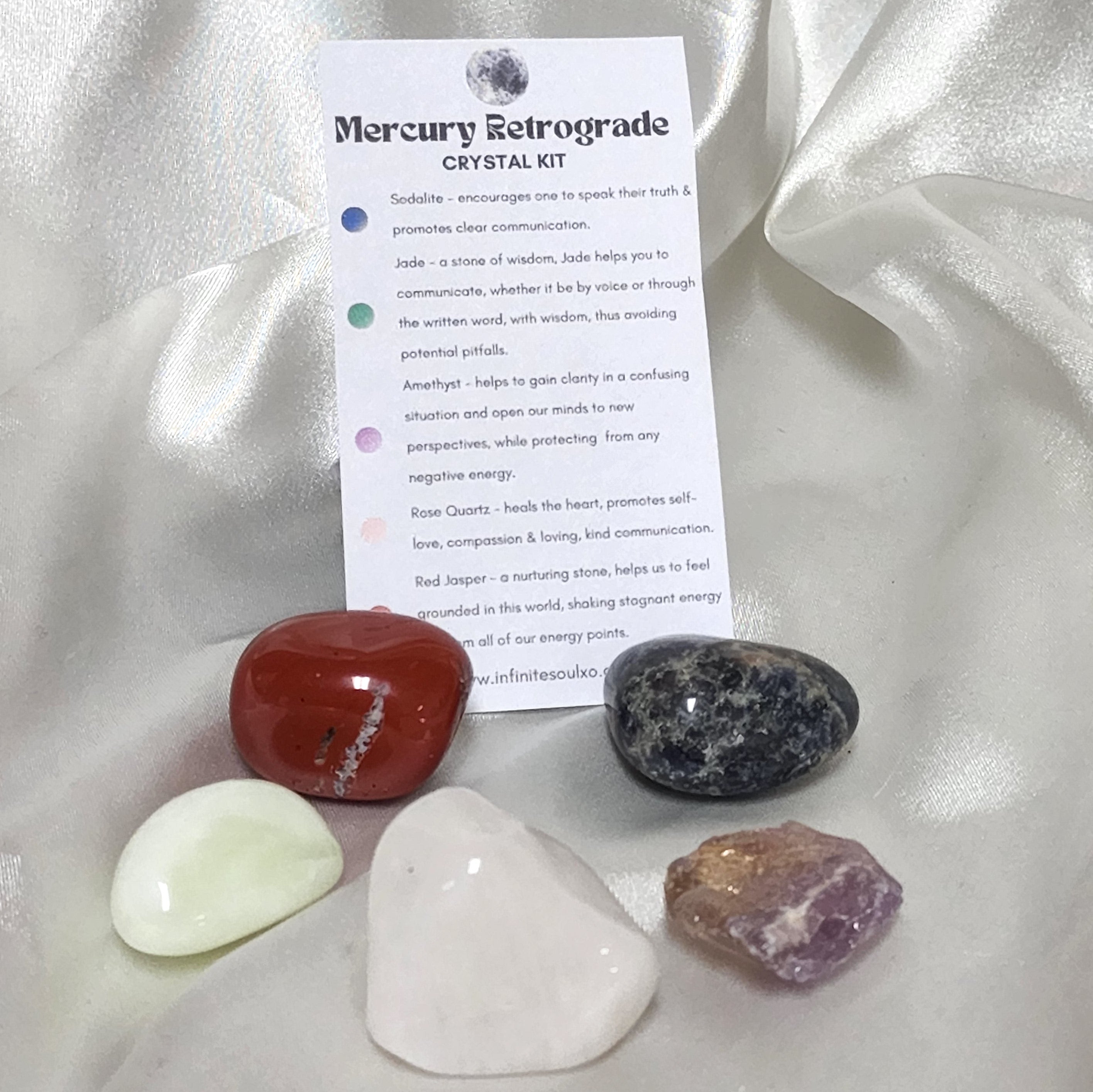 Mercury Retrograde Crystal Kit featuring Jade, Amethyst, Rose Quartz, Red Jasper, and Sodalite in a decorative arrangement.