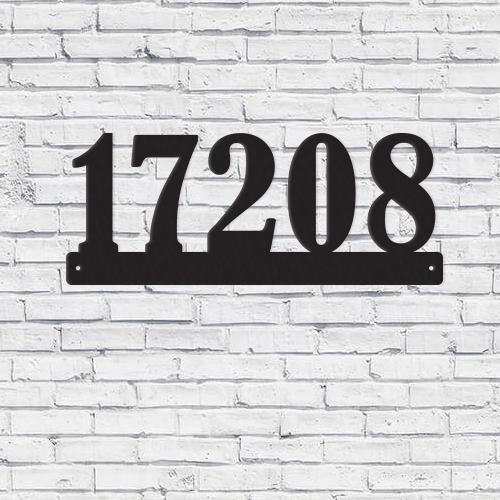 Modern horizontal metal house address sign displayed outdoors, showcasing sleek design and durability.