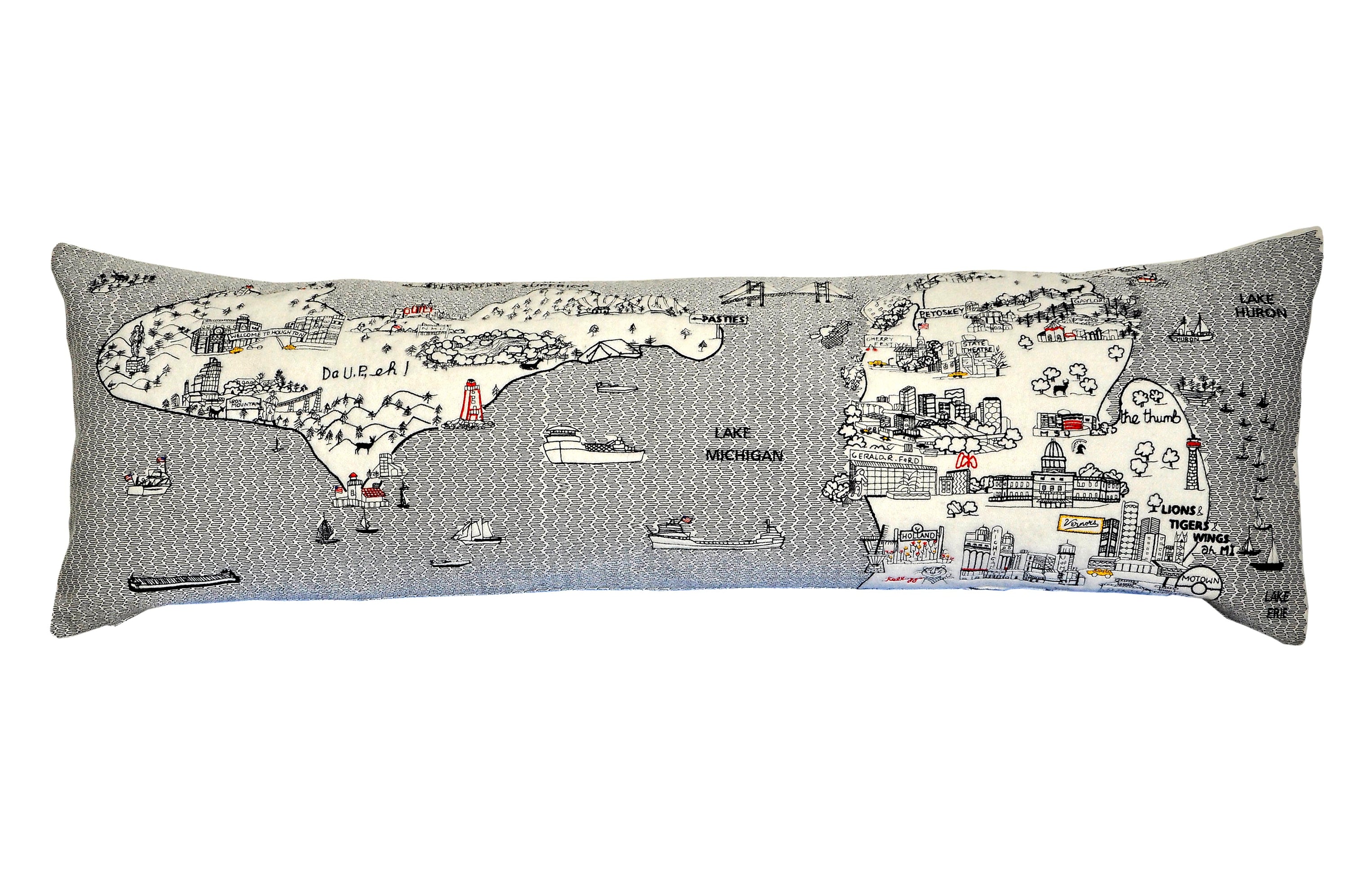 Michigan Pillow featuring a unique design inspired by Michigan's landscapes, with a red zipper at the bottom and soft wool fabric.