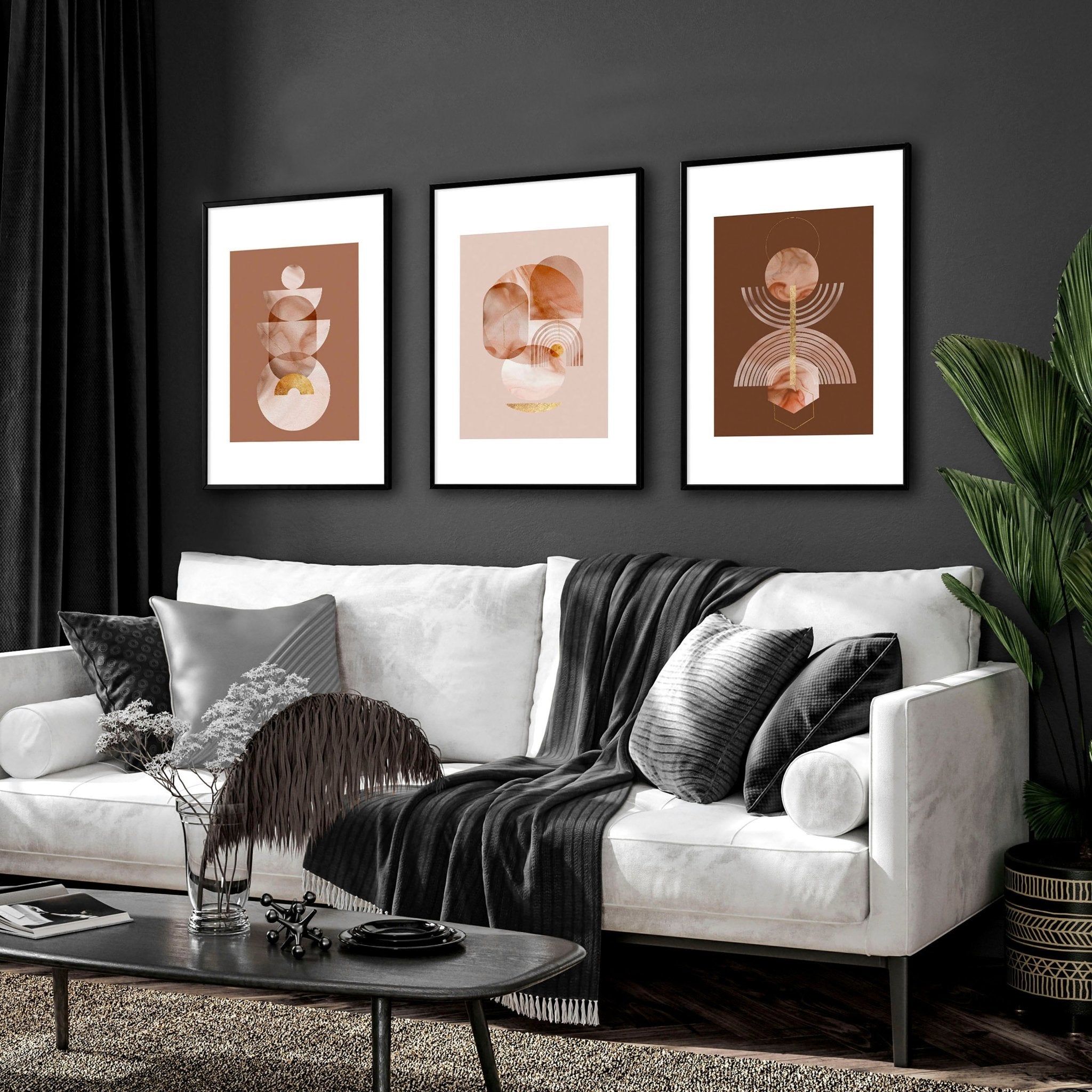 Set of 3 framed Mid Century Modern artwork prints featuring intricate designs in peach, terracotta, and gold colors, perfect for home decor.