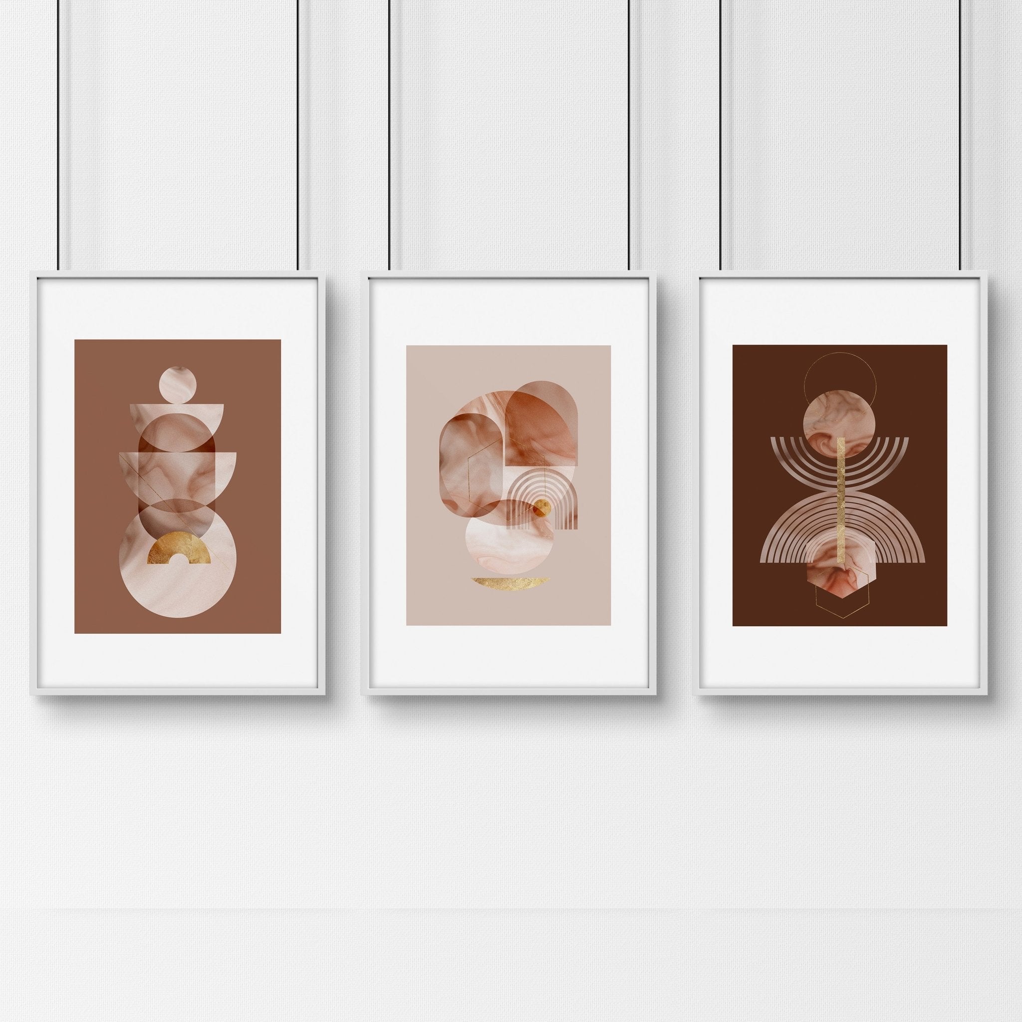 Set of 3 framed Mid Century Modern artwork prints featuring intricate designs in peach, terracotta, and gold colors, perfect for home decor.