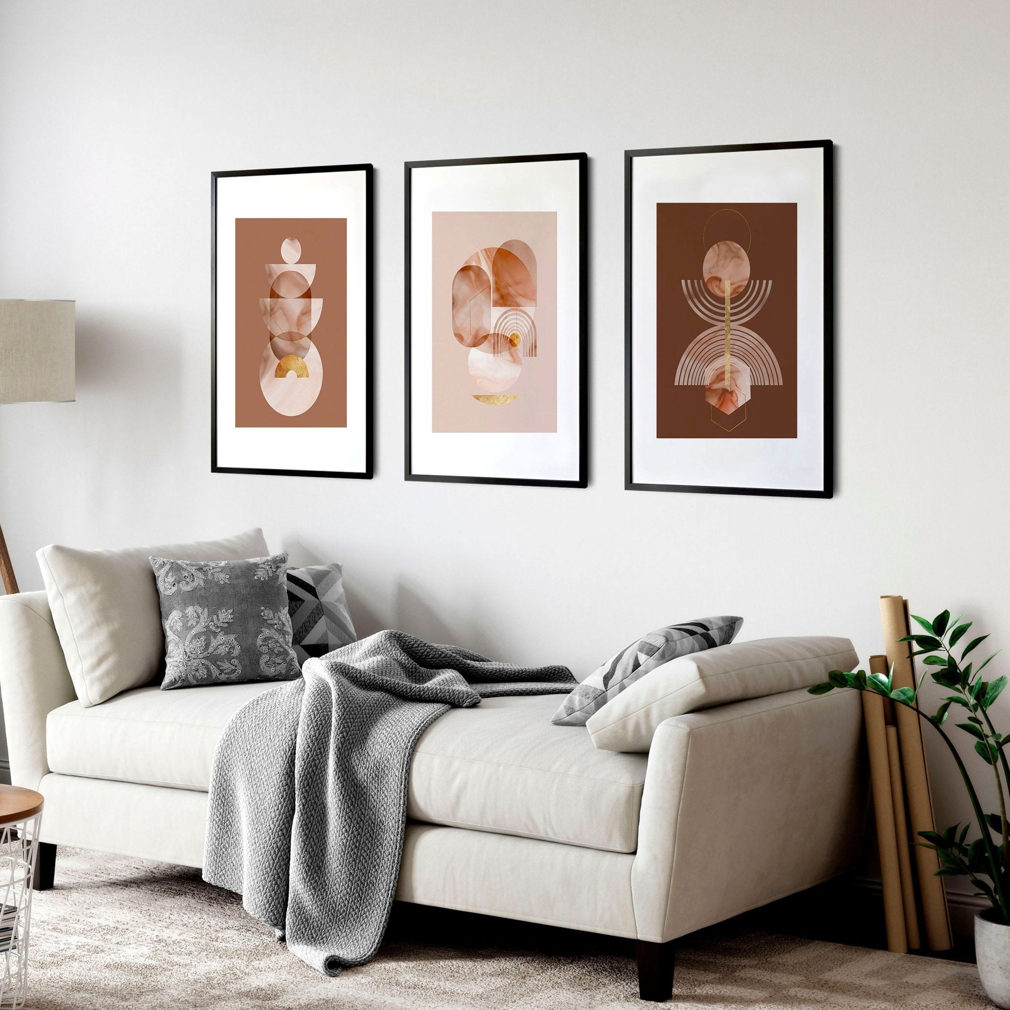 Set of 3 framed Mid Century Modern artwork prints featuring intricate designs in peach, terracotta, and gold colors, perfect for home decor.