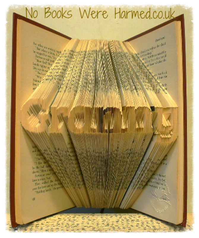 Mini 'Granny' art piece handcrafted from vintage books, showcasing intricate hand-folded pages in a unique design.