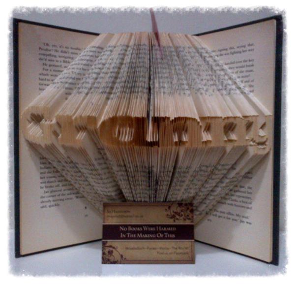 Mini 'Granny' art piece handcrafted from vintage books, showcasing intricate hand-folded pages in a unique design.