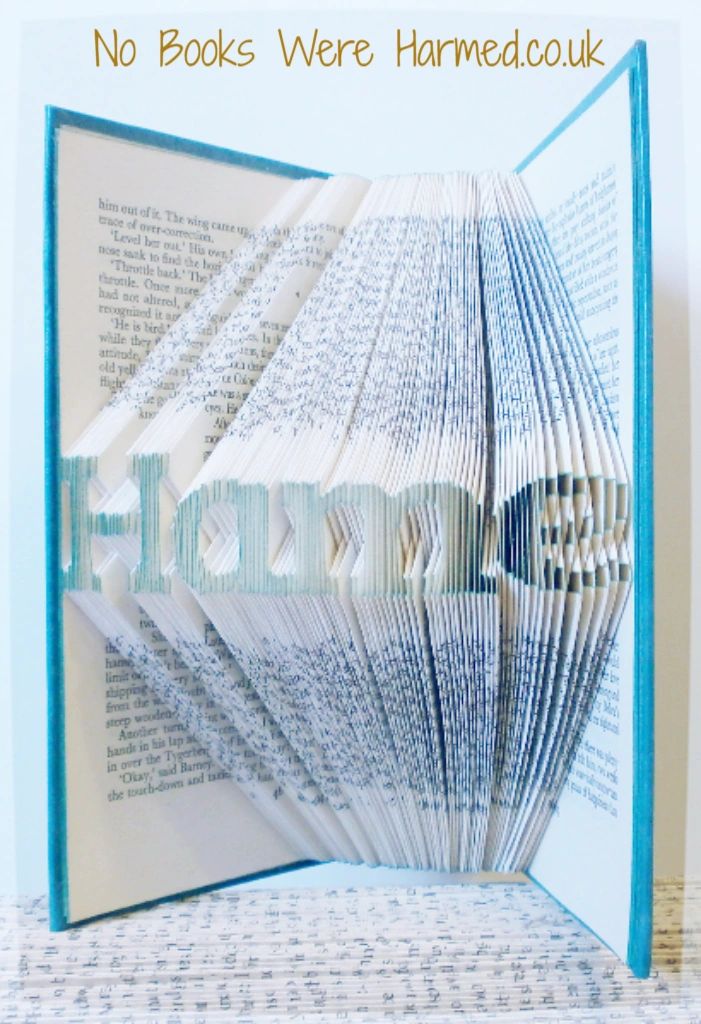 A handcrafted Mini 'Hame' art piece made from vintage book pages, showcasing intricate folds and unique design.