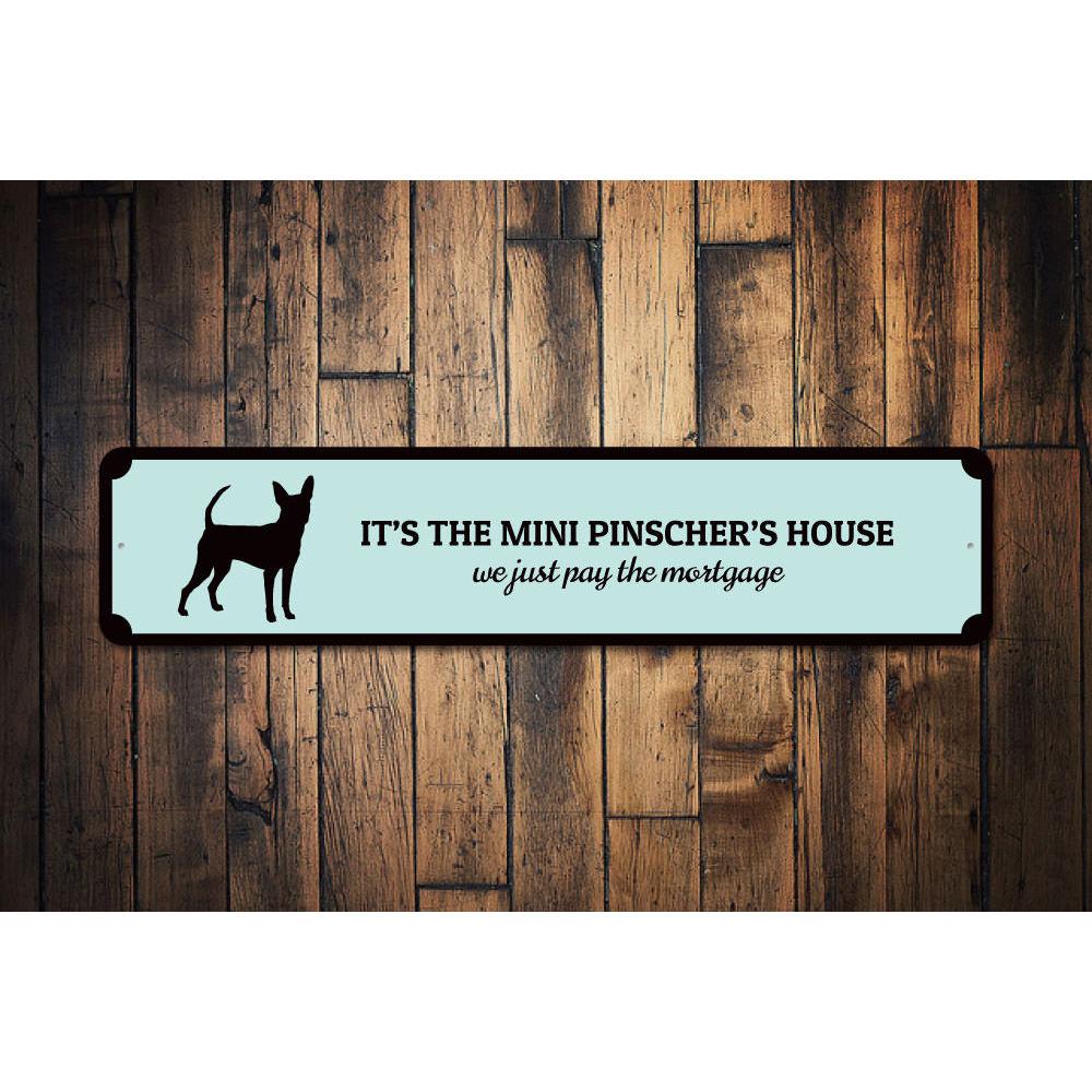 A decorative Mini Pinscher House Sign made of aluminum, featuring a customizable design, perfect for home decor.