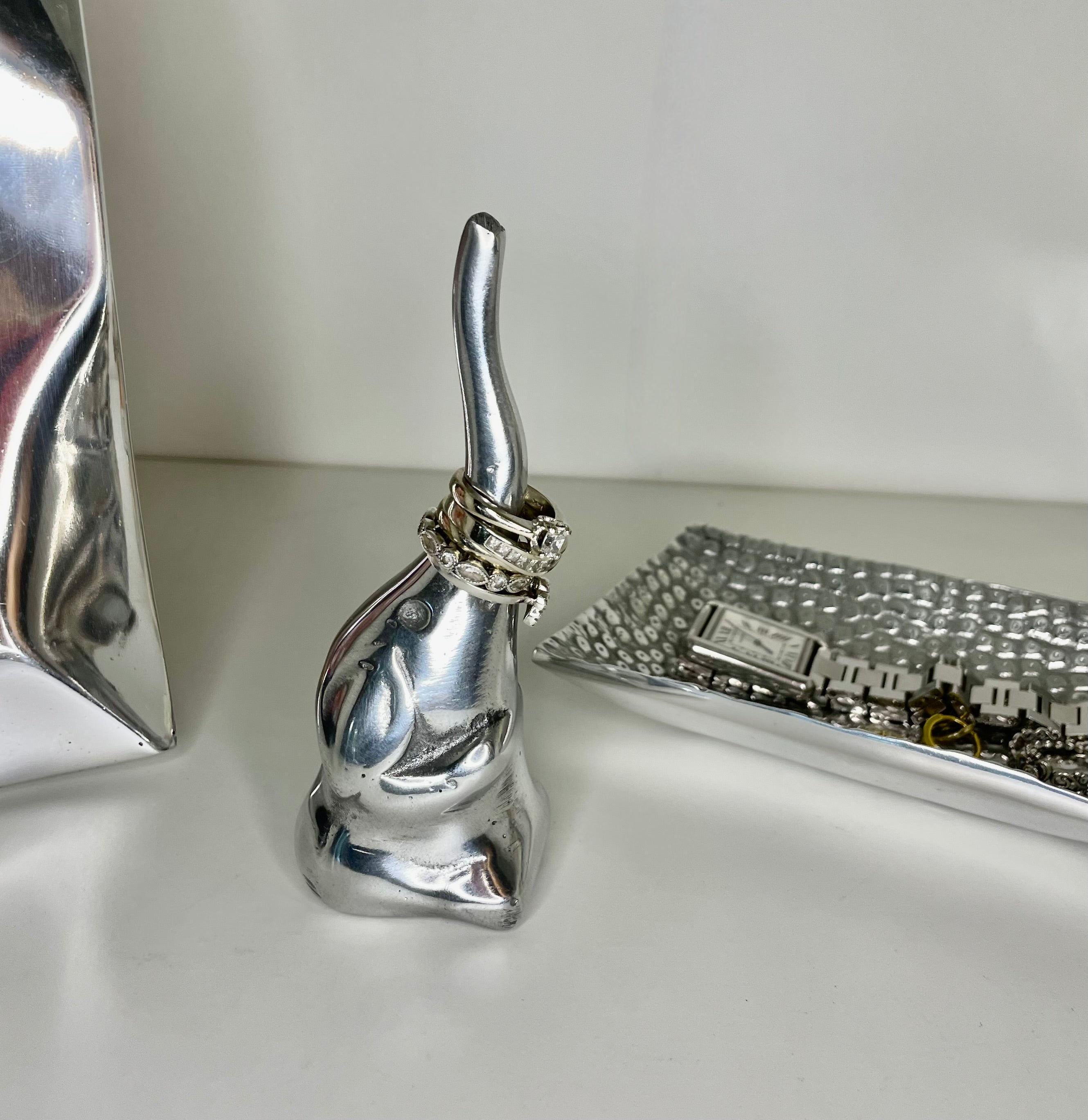 A collection of minimalist ring holders in animal shapes, crafted from recycled aluminum alloy, showcasing a sleek and modern design.