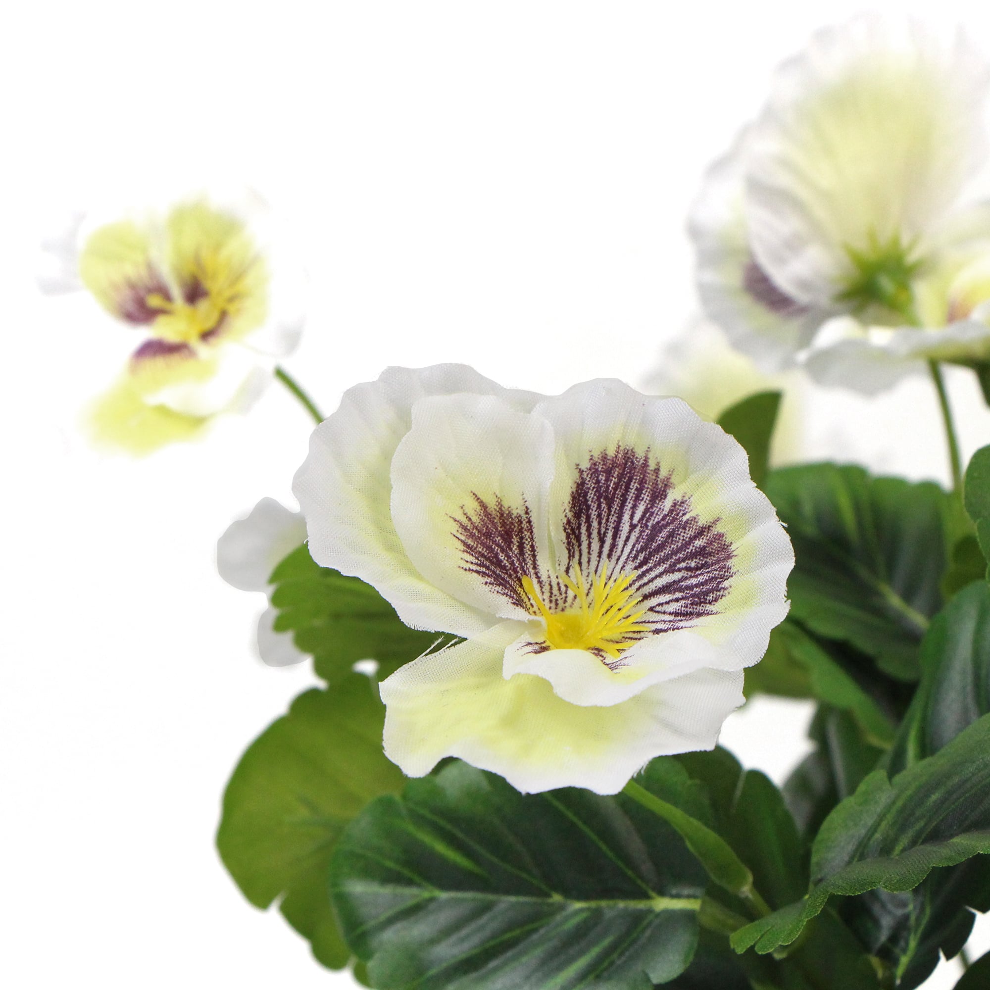 A beautiful arrangement of mixed white flowering artificial pansy plants in a decorative pot, showcasing realistic blooms and lush green leaves.