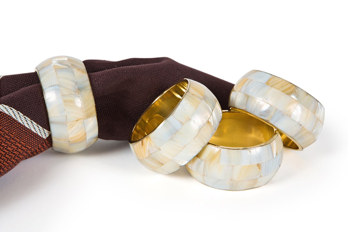 Set of four ML15818 Mother of Pearl Inlay Napkin Rings with elegant curved design and luxurious inlay, perfect for enhancing table settings.
