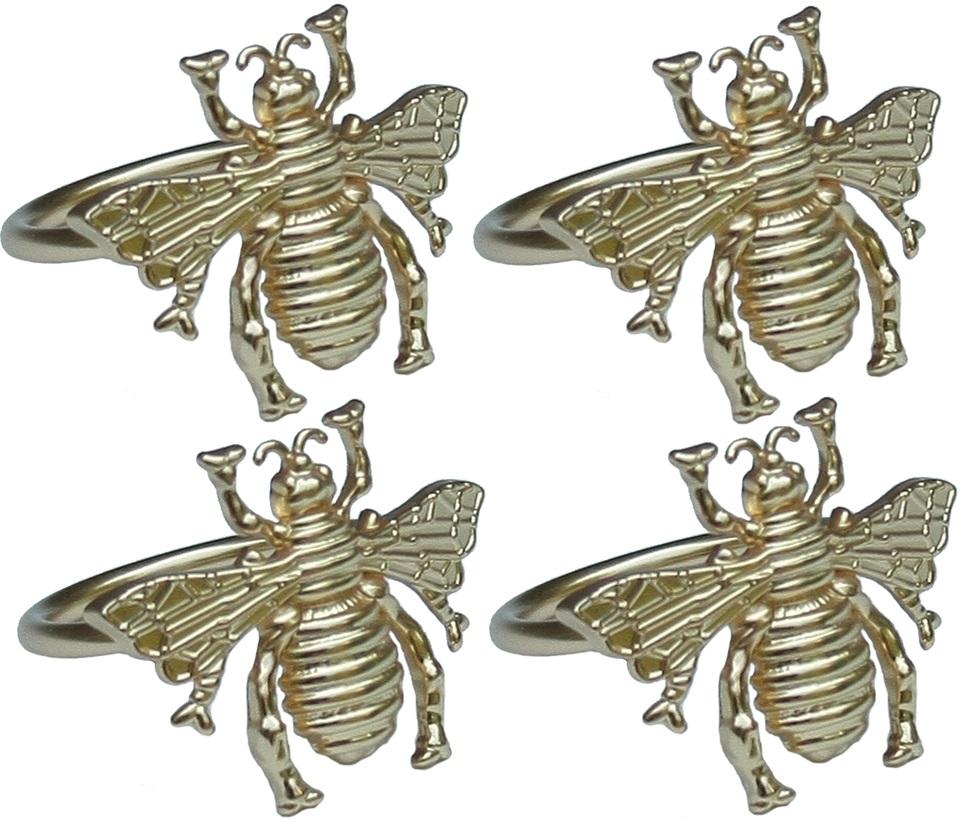 Set of four ML15853 Bourdon Napkin Rings featuring intricate regal carvings in durable brass, perfect for elegant dining.