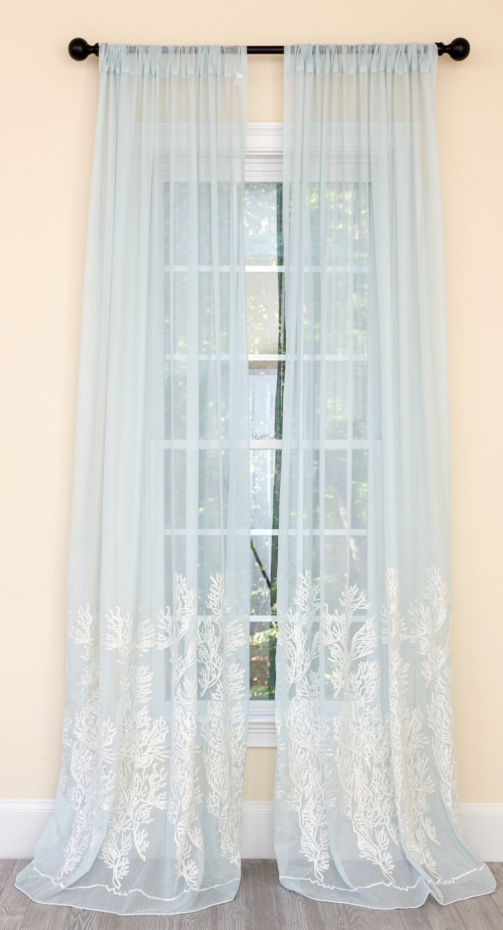ML19150 Vivid Ocean Coral Semi Sheer Curtain featuring white coral embroidery on aqua blue fabric, elegantly draping over a window.