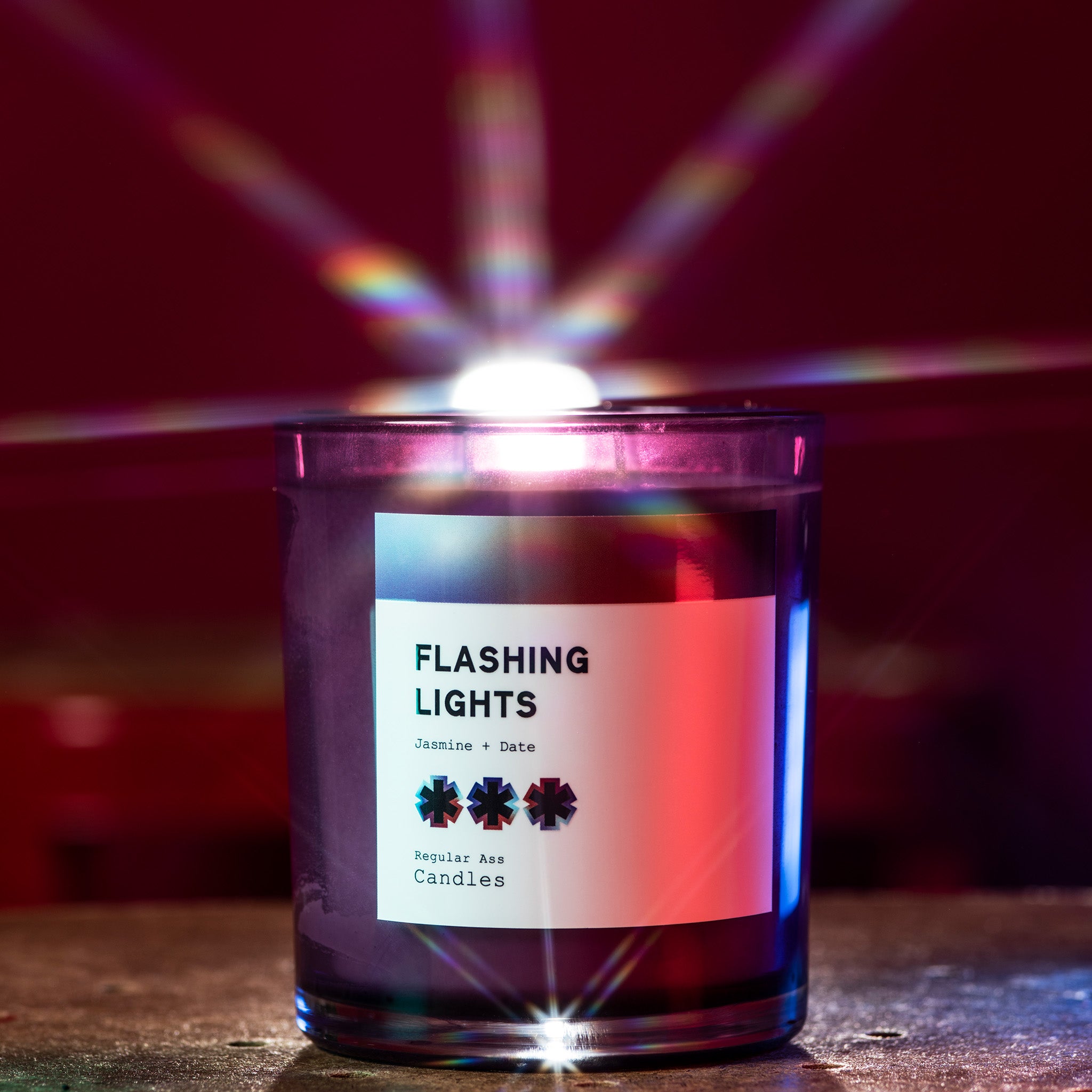 Mood Ring Black Plum + Amber 11oz Candle in a stylish jar, showcasing its vibrant colors and eco-friendly packaging.