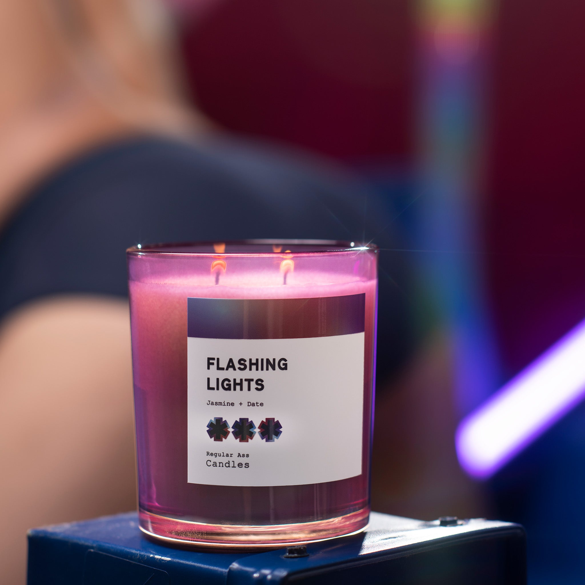 Mood Ring Black Plum + Amber 11oz Candle in a stylish jar, showcasing its vibrant colors and eco-friendly packaging.