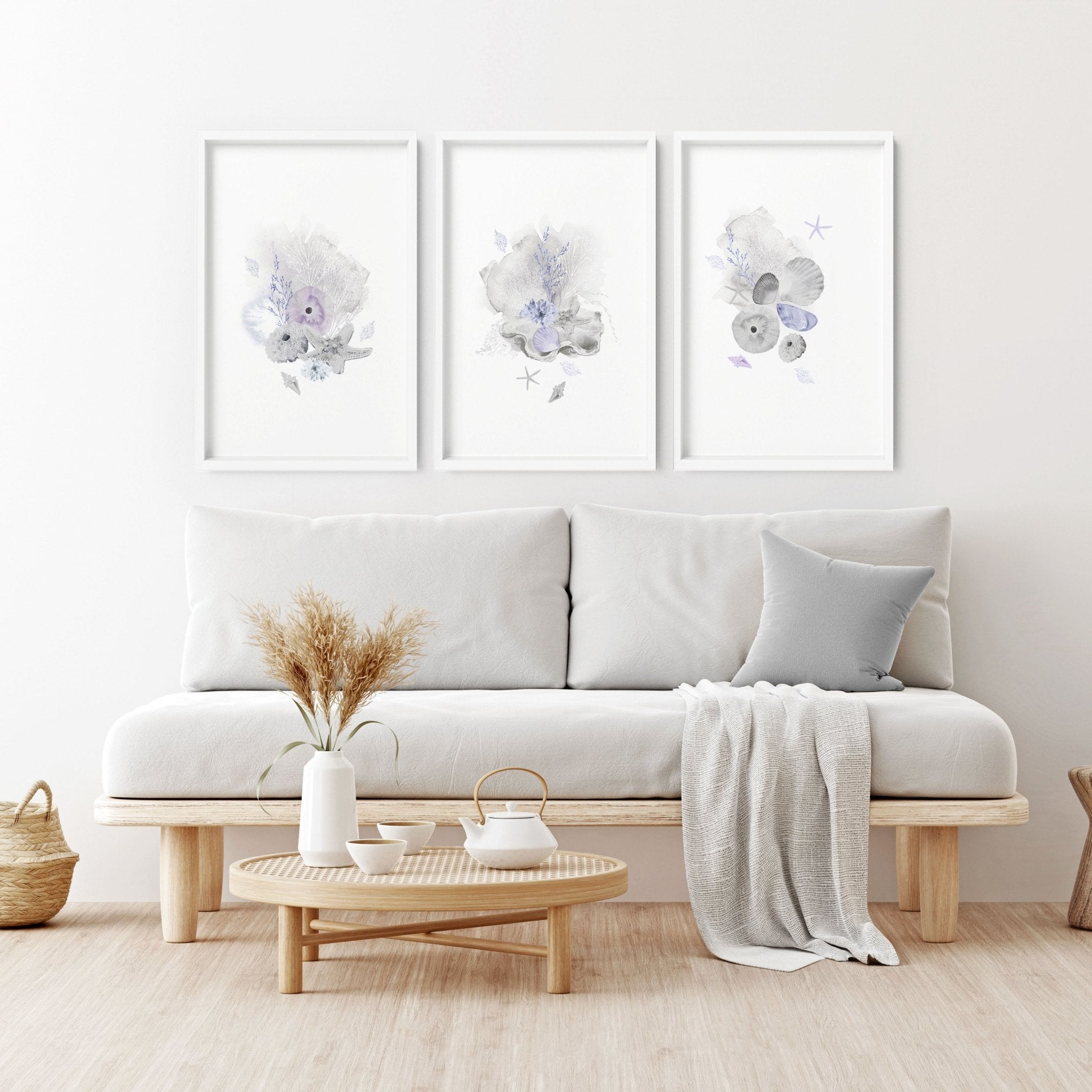 Set of 3 modern beach house wall art prints featuring coastal designs in blue and sandy beige colors, perfect for home decor.