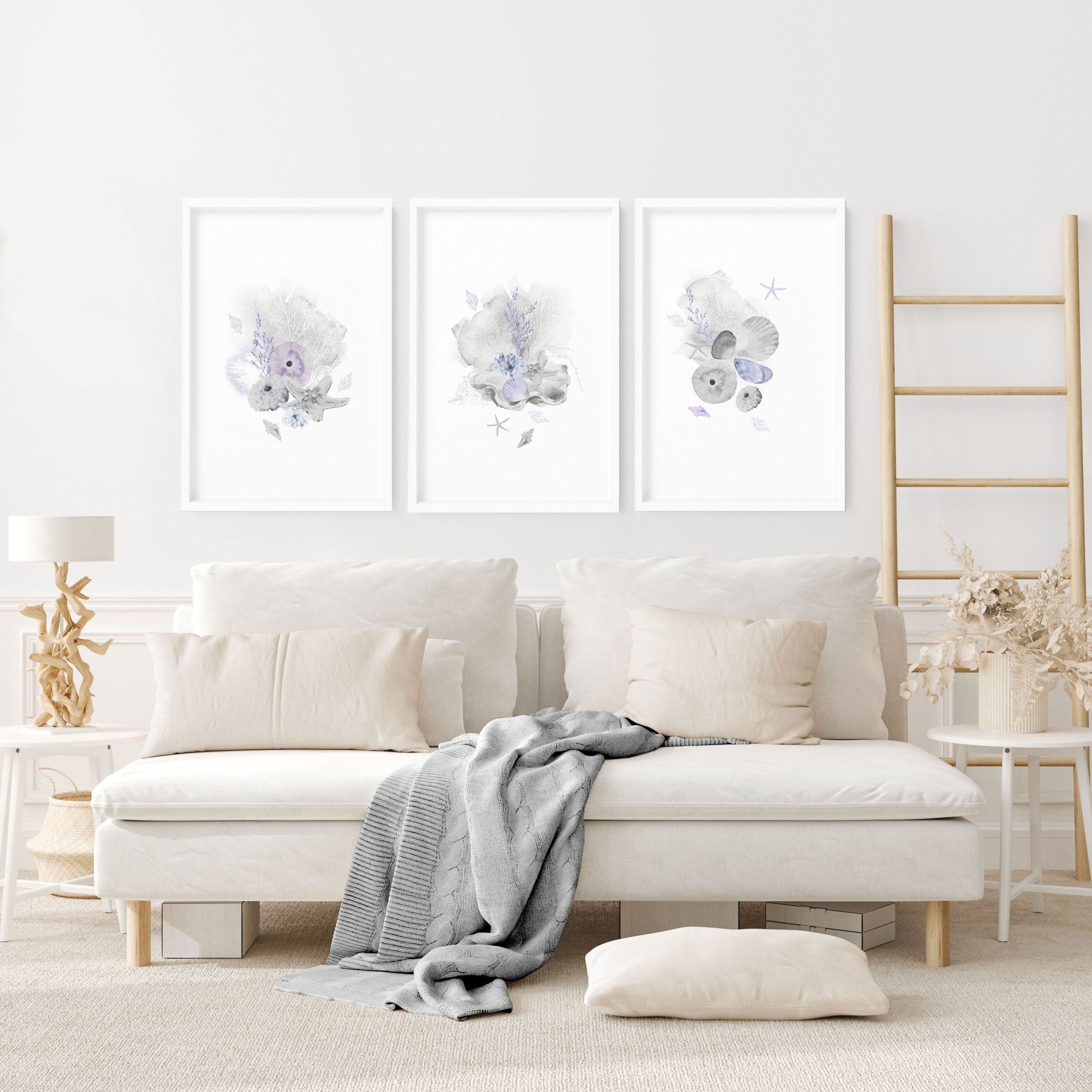 Set of 3 modern beach house wall art prints featuring coastal designs in blue and sandy beige colors, perfect for home decor.