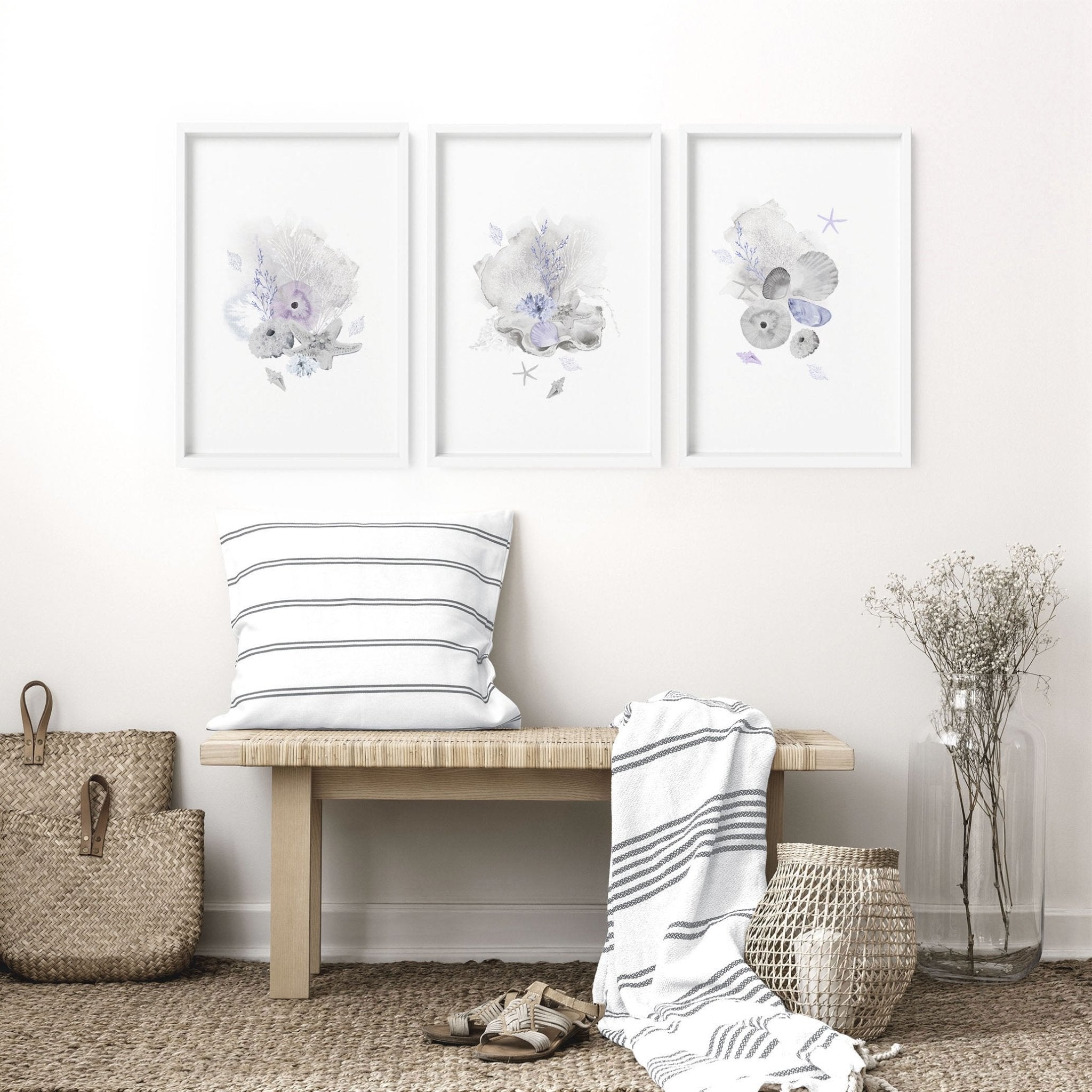 Set of 3 modern beach house wall art prints featuring coastal designs in blue and sandy beige colors, perfect for home decor.