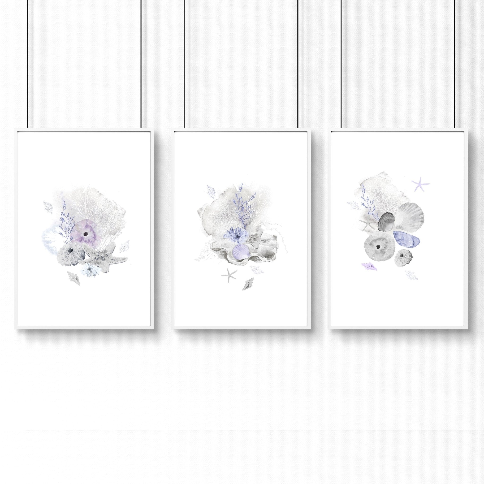 Set of 3 modern beach house wall art prints featuring coastal designs in blue and sandy beige colors, perfect for home decor.