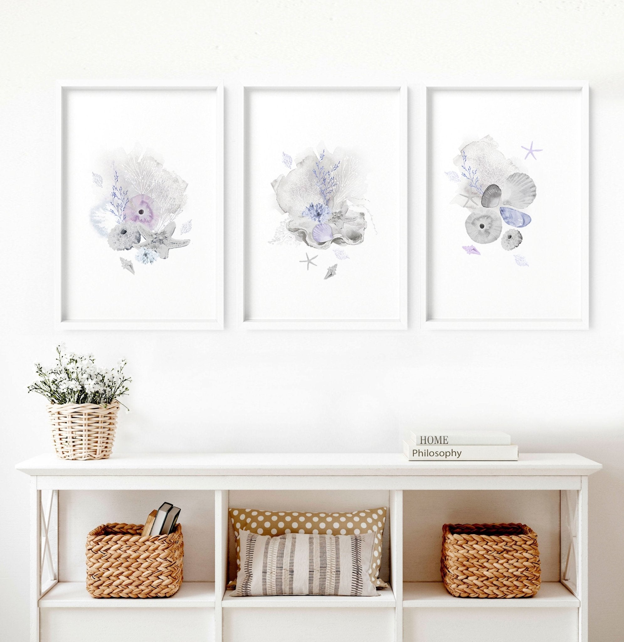 Set of 3 modern beach house wall art prints featuring coastal designs in blue and sandy beige colors, perfect for home decor.