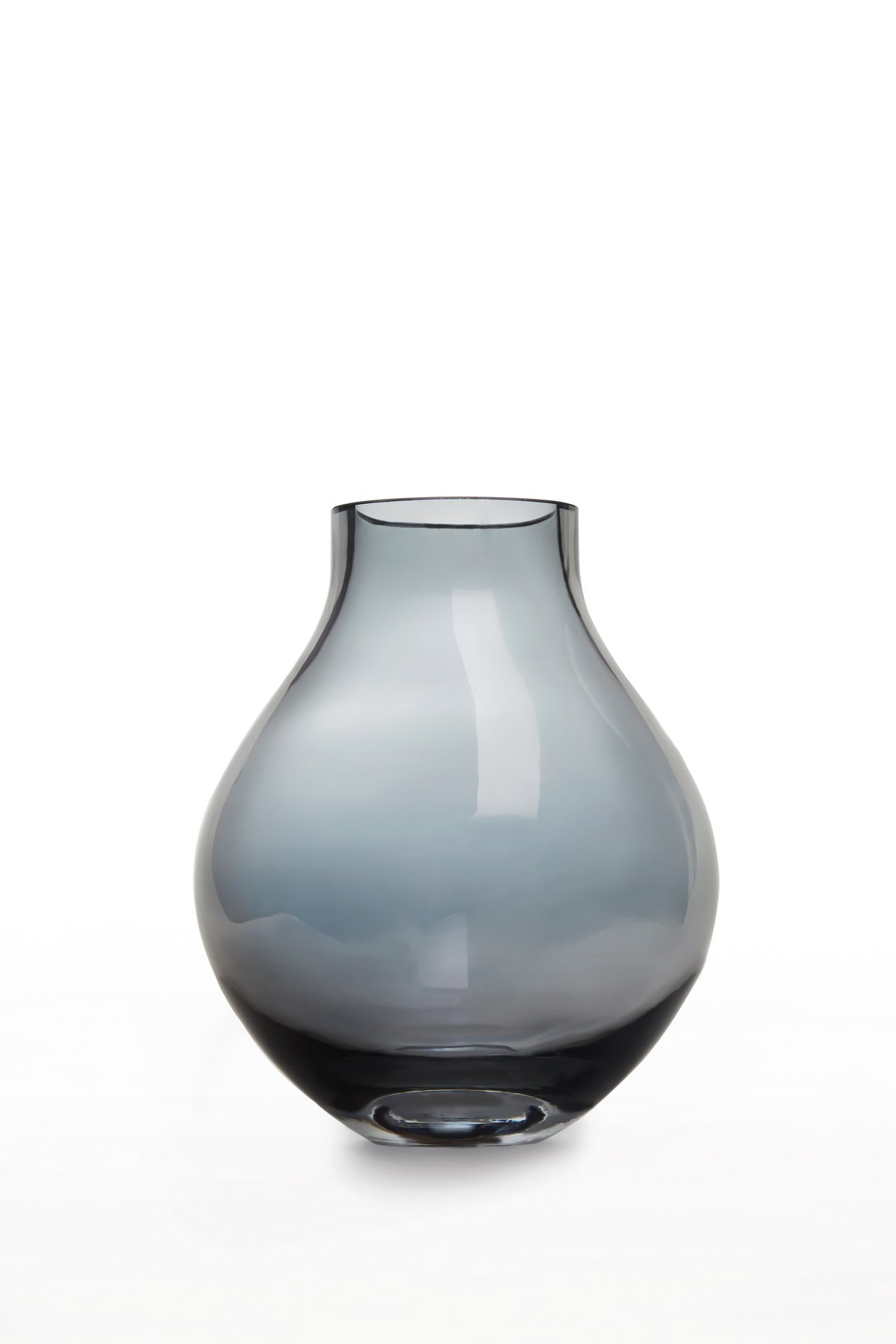 Modern classic bulb-shaped glass vase in subtle indigo light blue, showcasing elegant curves and a super flat finish.